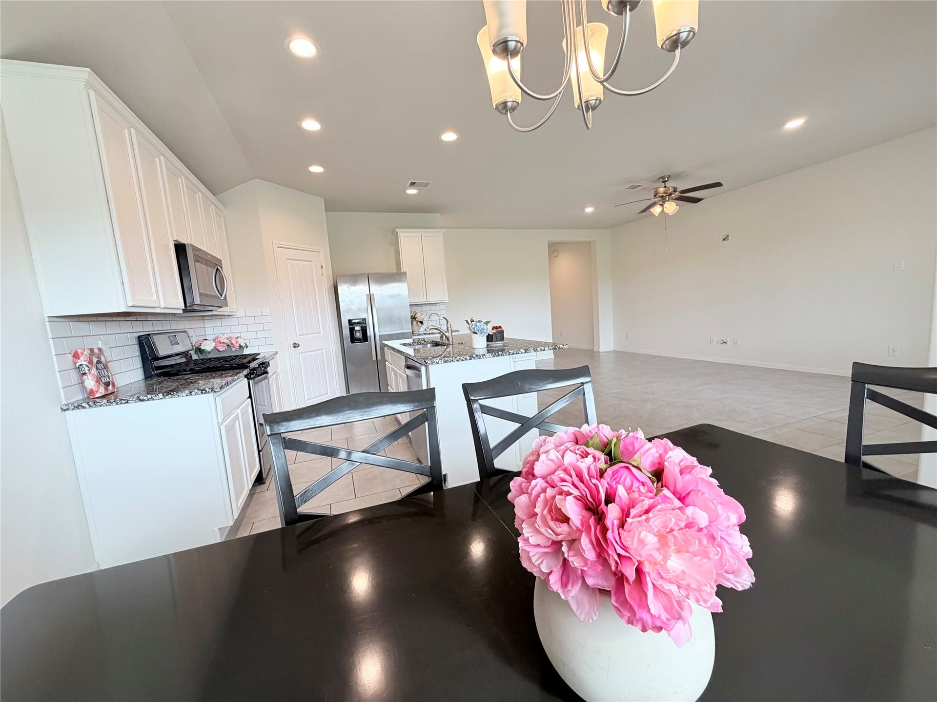Dining area opens seamlessly to the kitchen and living spaces.