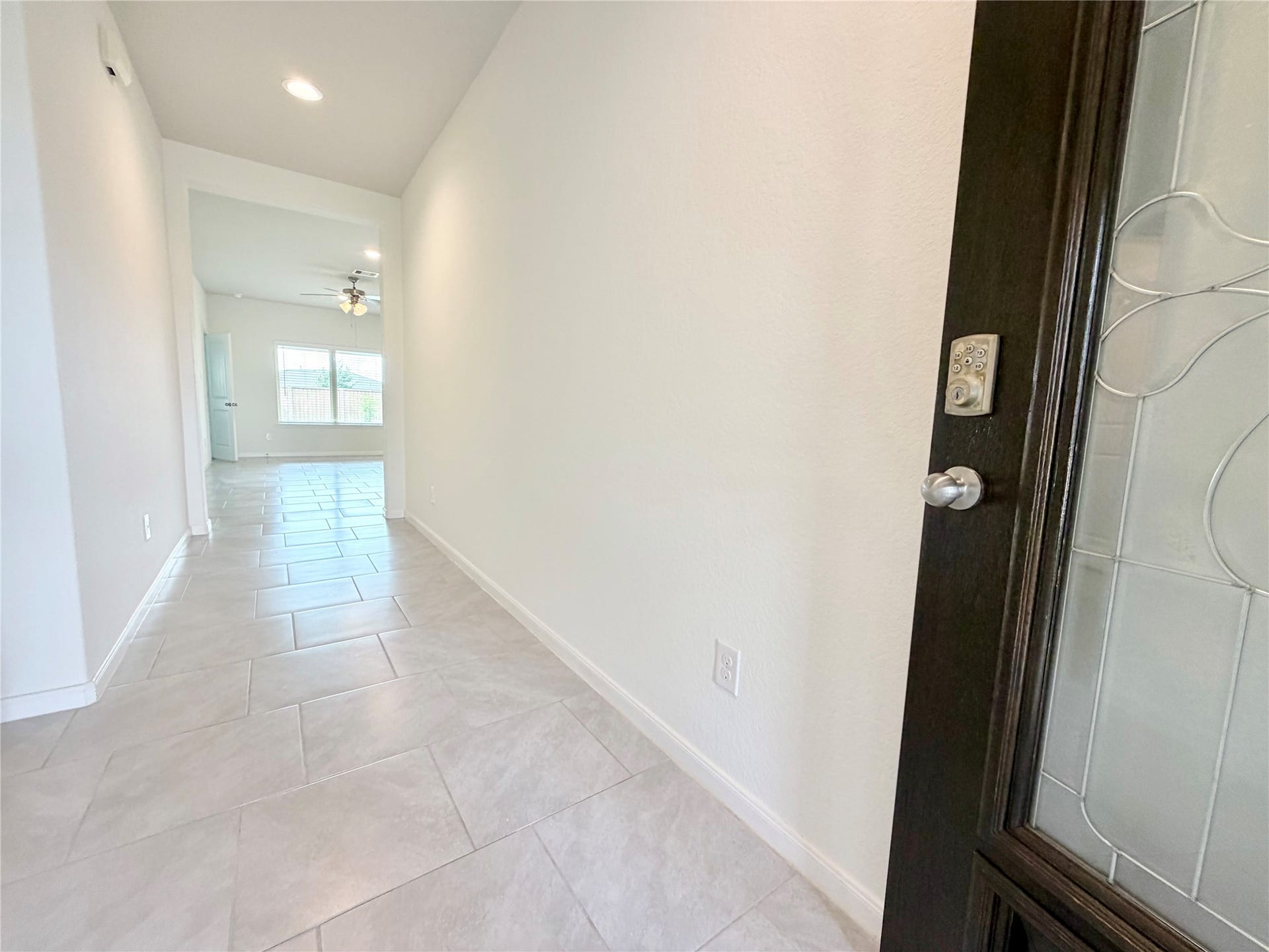 Upon entering the front door, bedrooms 2 and 3 and the hall bathroom are located on the left hallway.