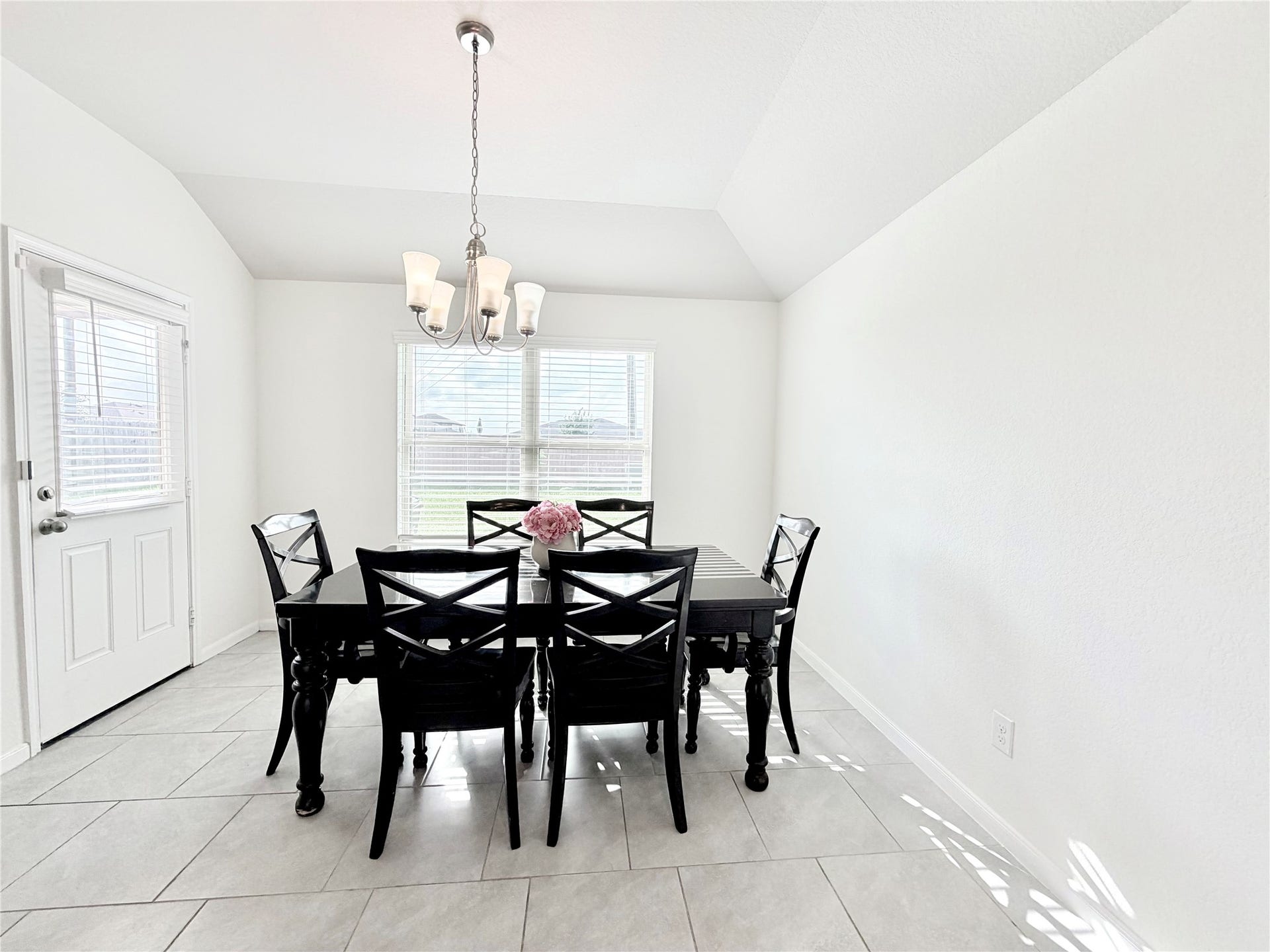 Gather family and friends in the spacious dining area, perfectly positioned between the kitchen and living room.