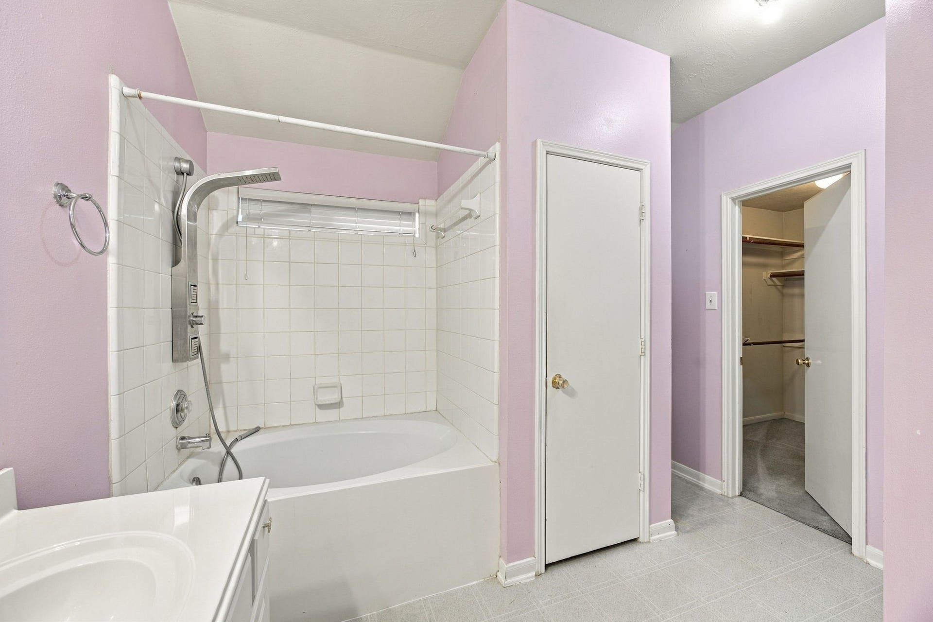 Primary bathroom with walk-in closet and linen closet.