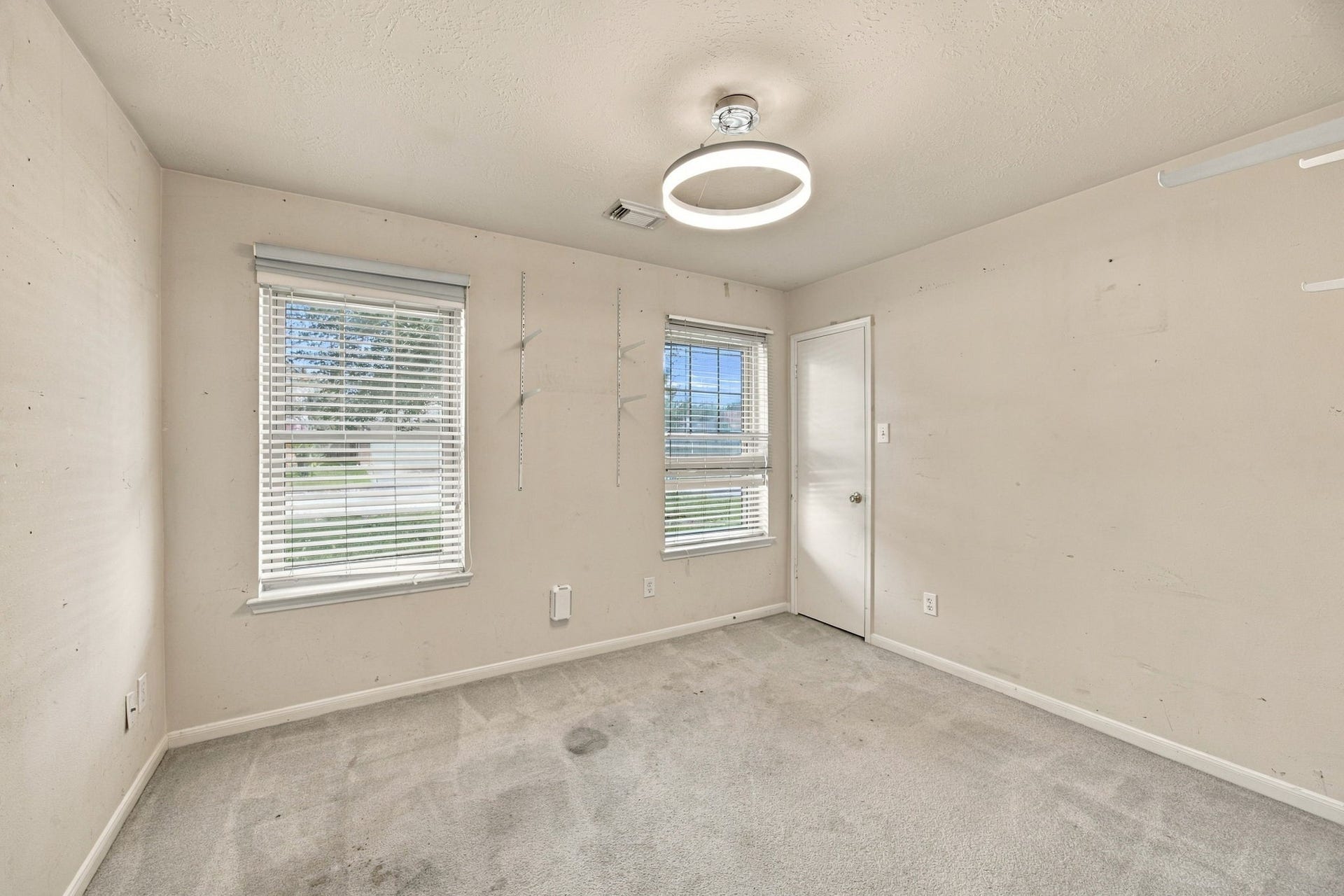 Secondary bedroom with walk-in closet; great natural light.