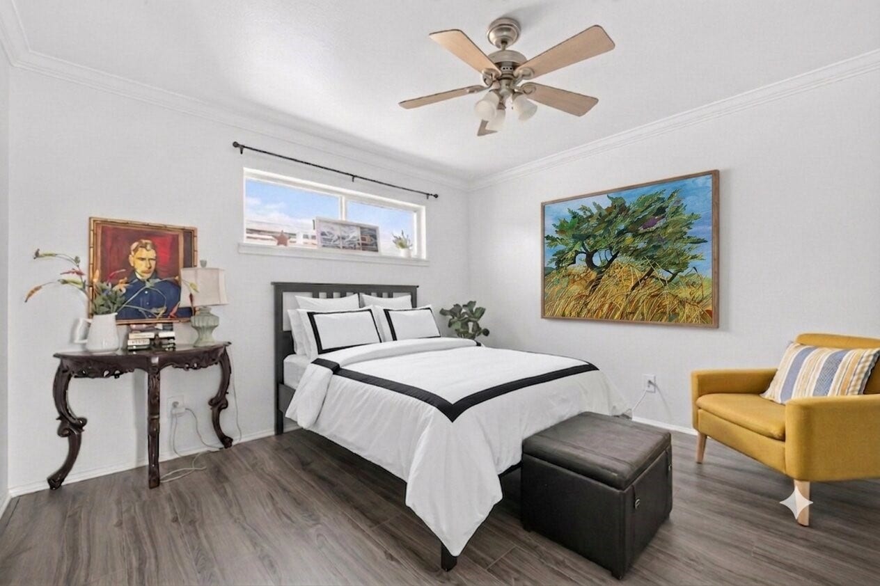 6402 Del Monte Drive, #65, Houston, TX 77057 This cozy bedroom features a modern design with a neutral color palette, elegant wood flooring, and ample natural light from a high window. It includes a comfortable bed with crisp linens, a ceiling fan, and stylish decor elements like artwork and a chic side table.