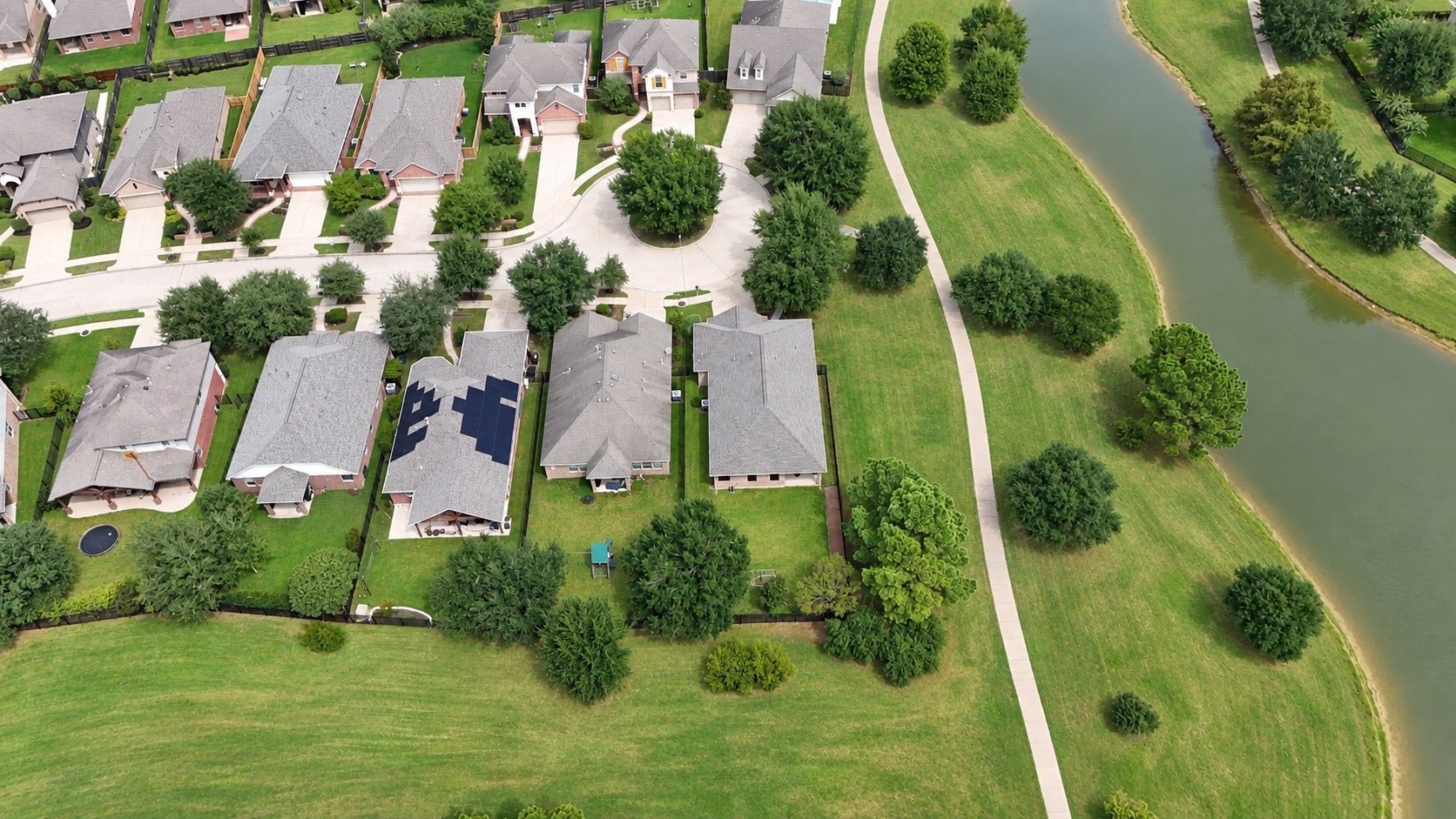 18803 Cove Mill Lane, Cypress, TX 77433 Overhead view of the house showcasing the lake to the right and greenbelt behind. Very private!