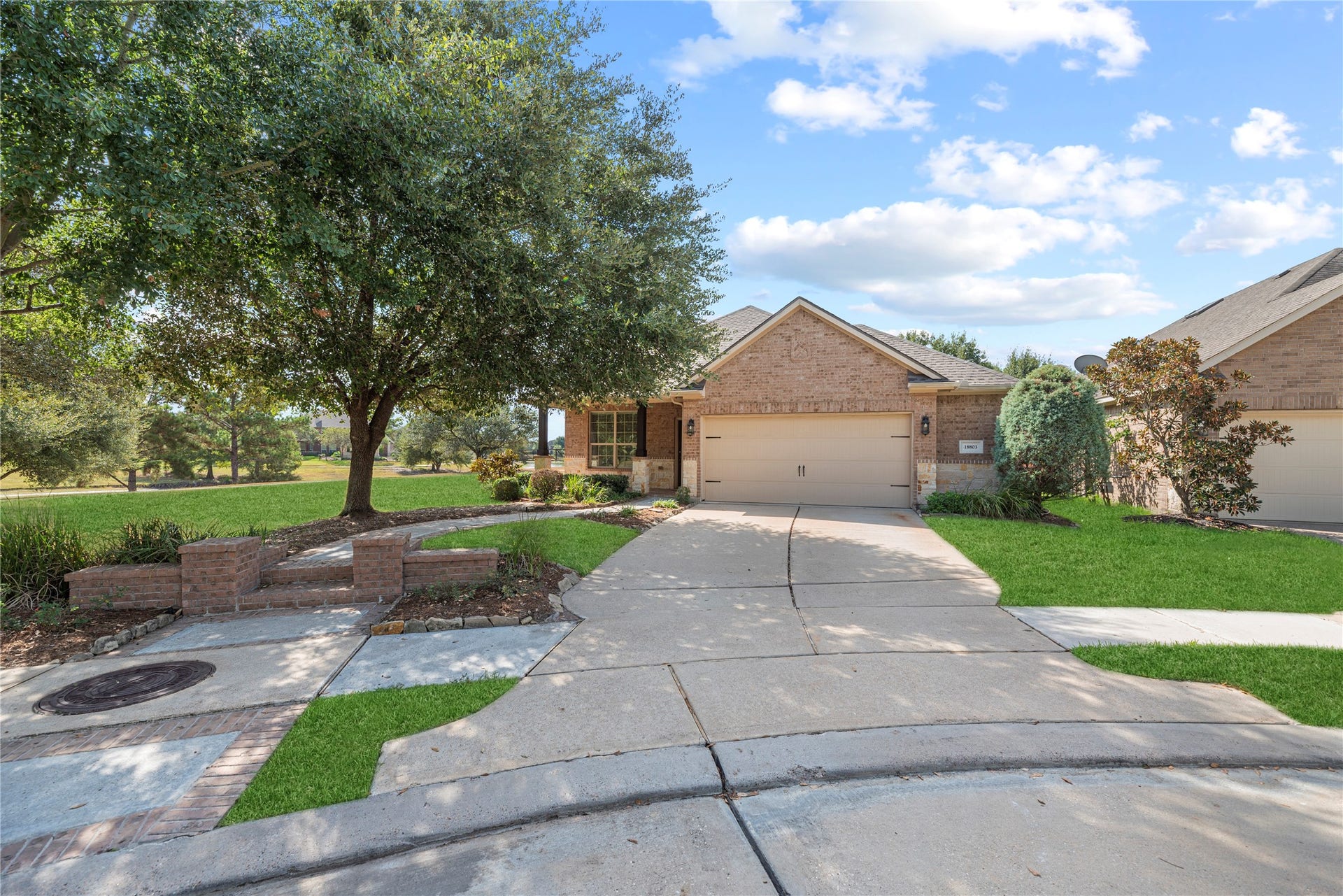 18803 Cove Mill Lane, Cypress, TX 77433 Long driveway with a garage extension to the right.