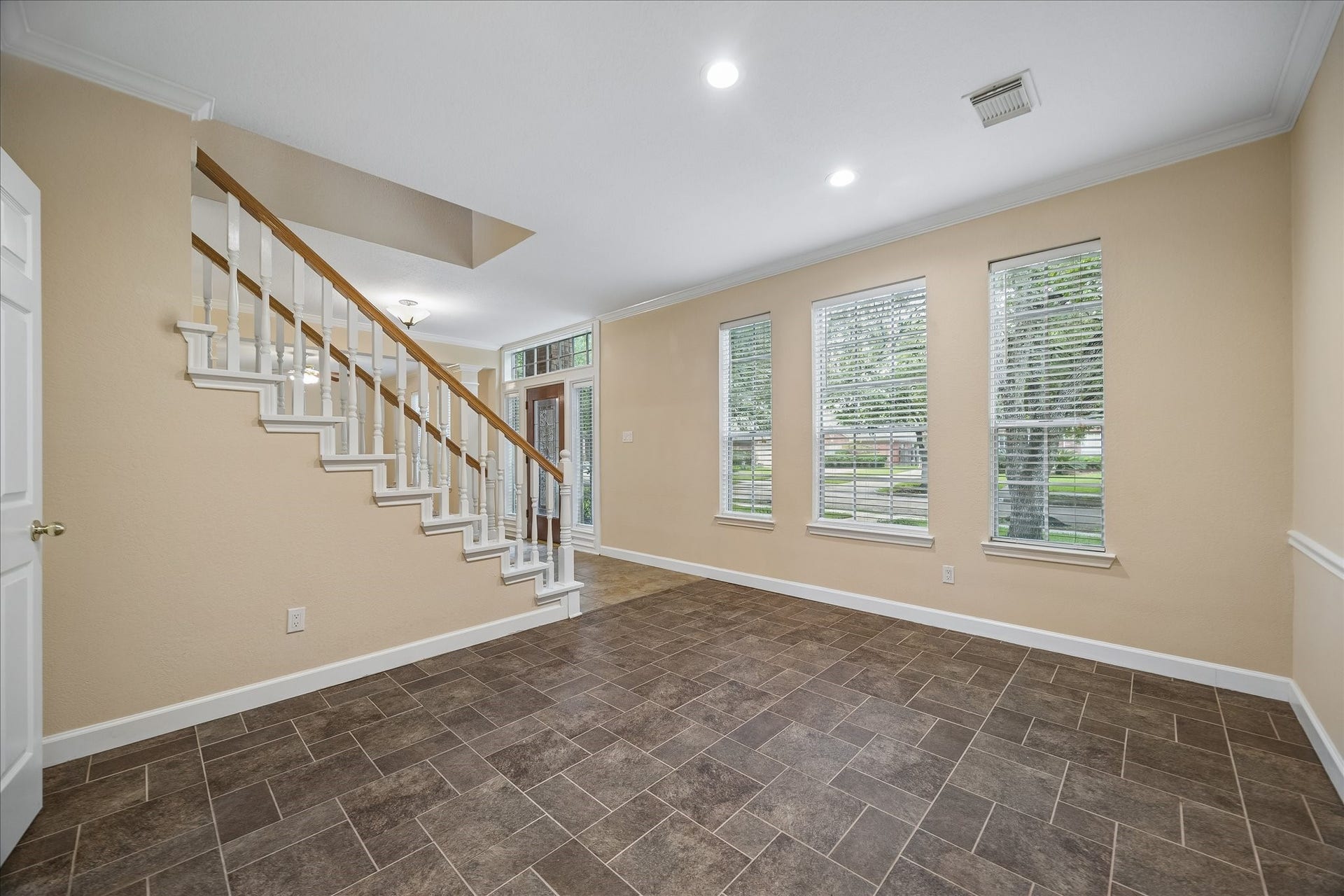 16715 Colony Terrace Drive, Sugar Land, TX 77479 And this is a view of the dining room looking towards the foyer. The door you can barely see on the left leads to the kitchen. Fresh paint throughout.