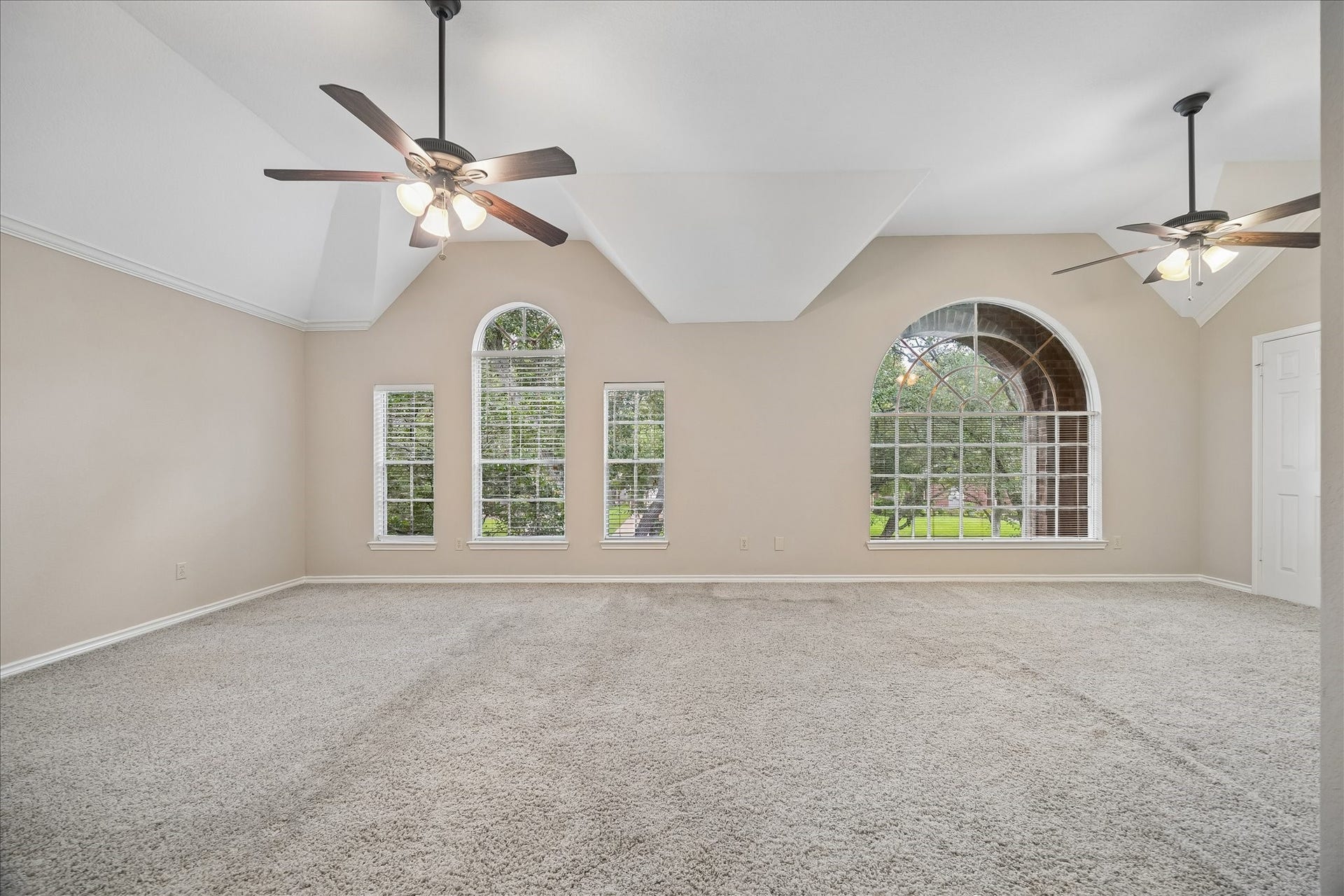 16715 Colony Terrace Drive, Sugar Land, TX 77479 Another view of the primary bedroom with the windows looking out to the front of the house. Soaring ceilings.