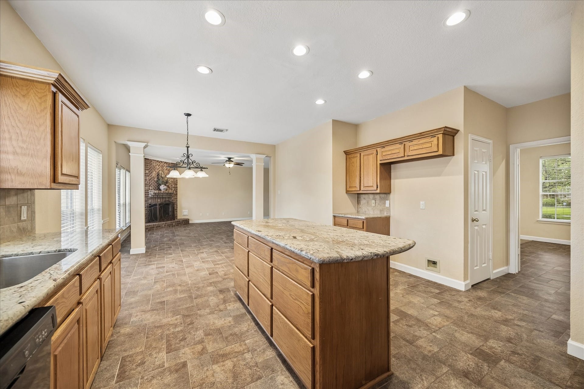 16715 Colony Terrace Drive, Sugar Land, TX 77479 And this view essentially from the back door, looks to the breakfast room and family room. The door on the right leads to the large walk-in pantry. And the far right is the dining room.