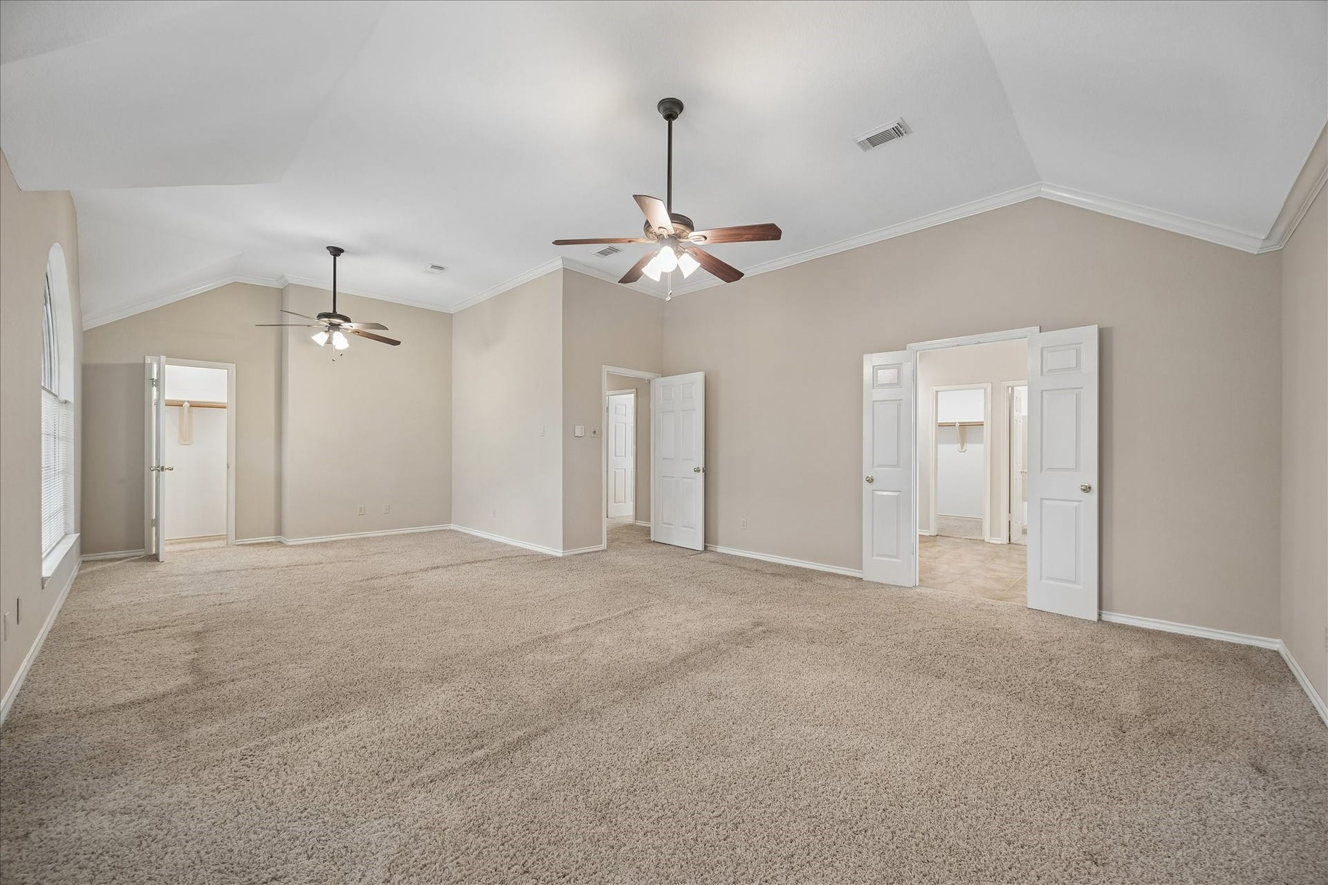 16715 Colony Terrace Drive, Sugar Land, TX 77479 And one more view of the primary bedroom. Through the double doors is the primary spa-like bathroom.