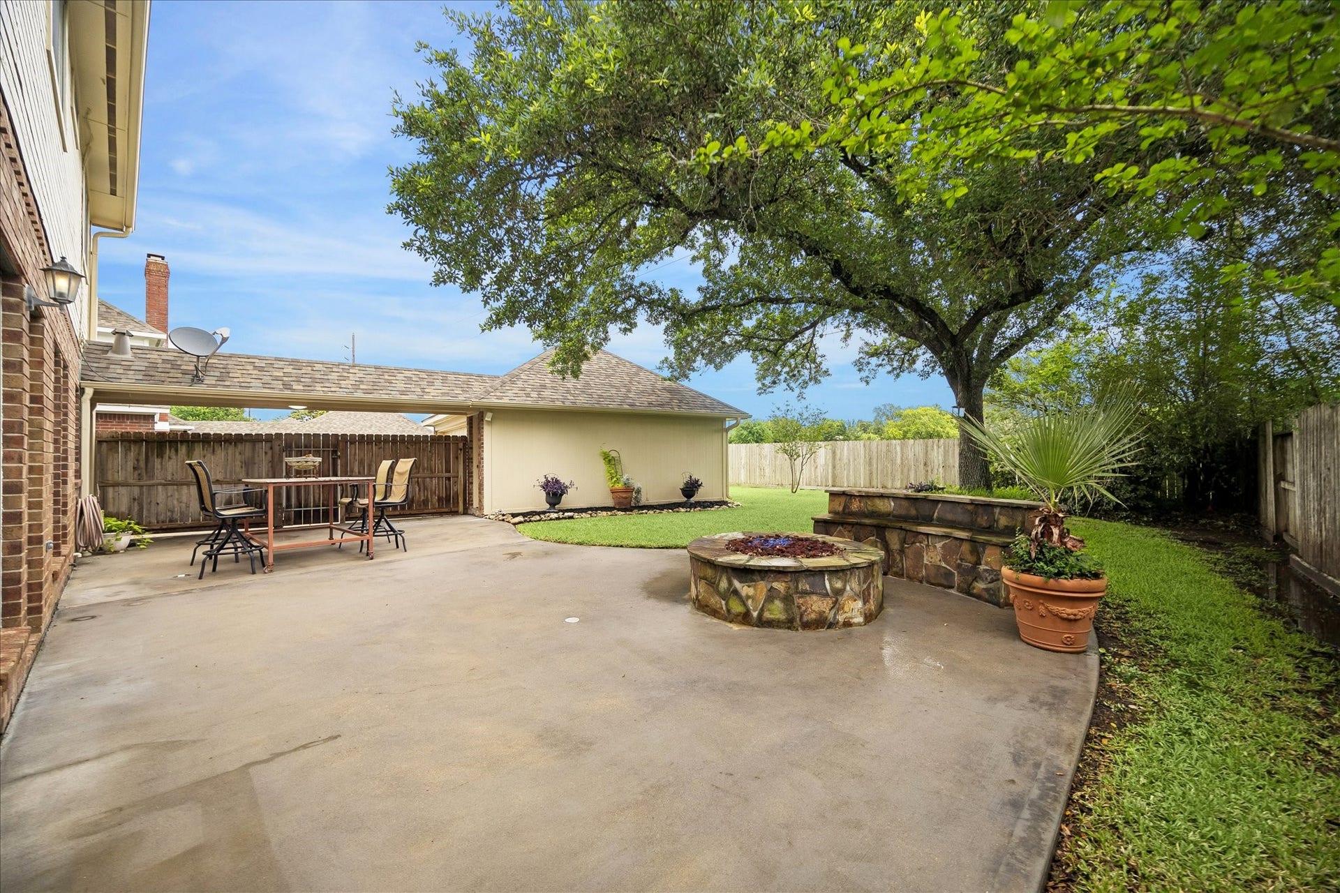 16715 Colony Terrace Drive, Sugar Land, TX 77479 And a look from the back side of the house towards the gas firepit. Plenty of grass for kids and pets to run around. And again, no back neighbors!
