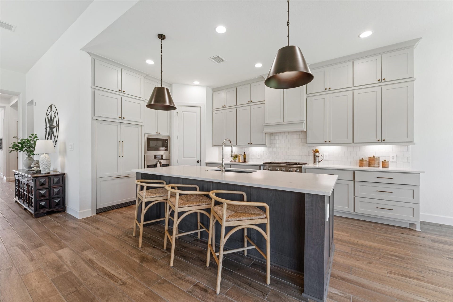 607 Starlit Sky Court, Willis, TX 77318 Exceptional Fisher Paykel French door refrigerator with custom cabinet panels