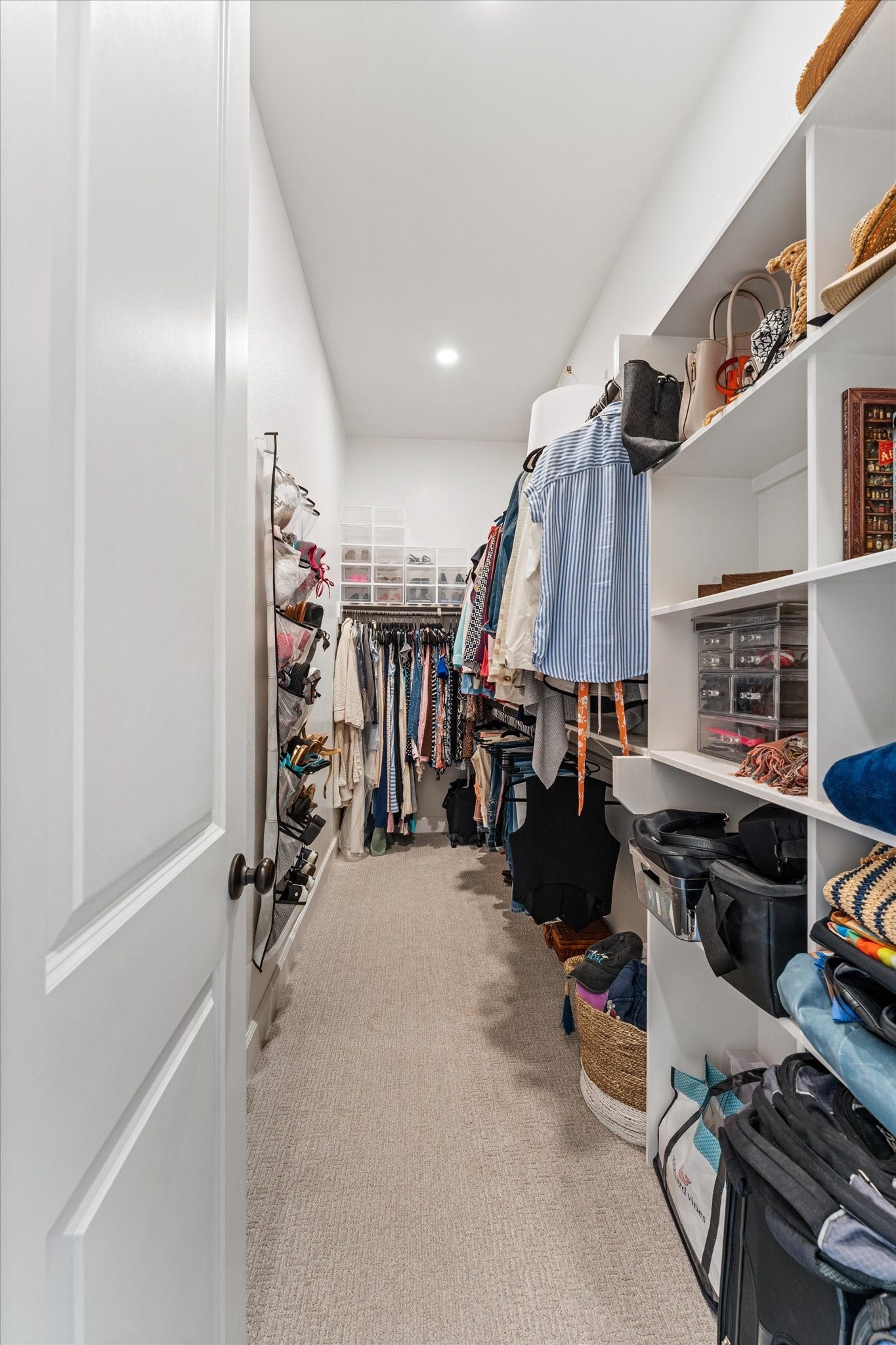 607 Starlit Sky Court, Willis, TX 77318 Primary closet with shelving