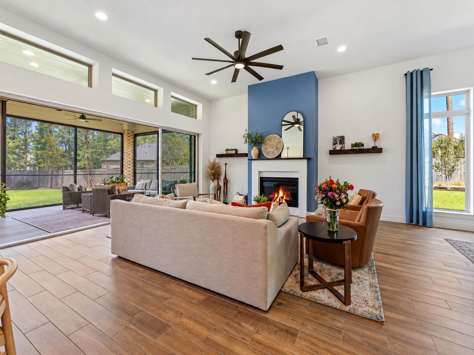 607 Starlit Sky Court, Willis, TX 77318 Wall of sliding doors open to extended patio complete with remote screens