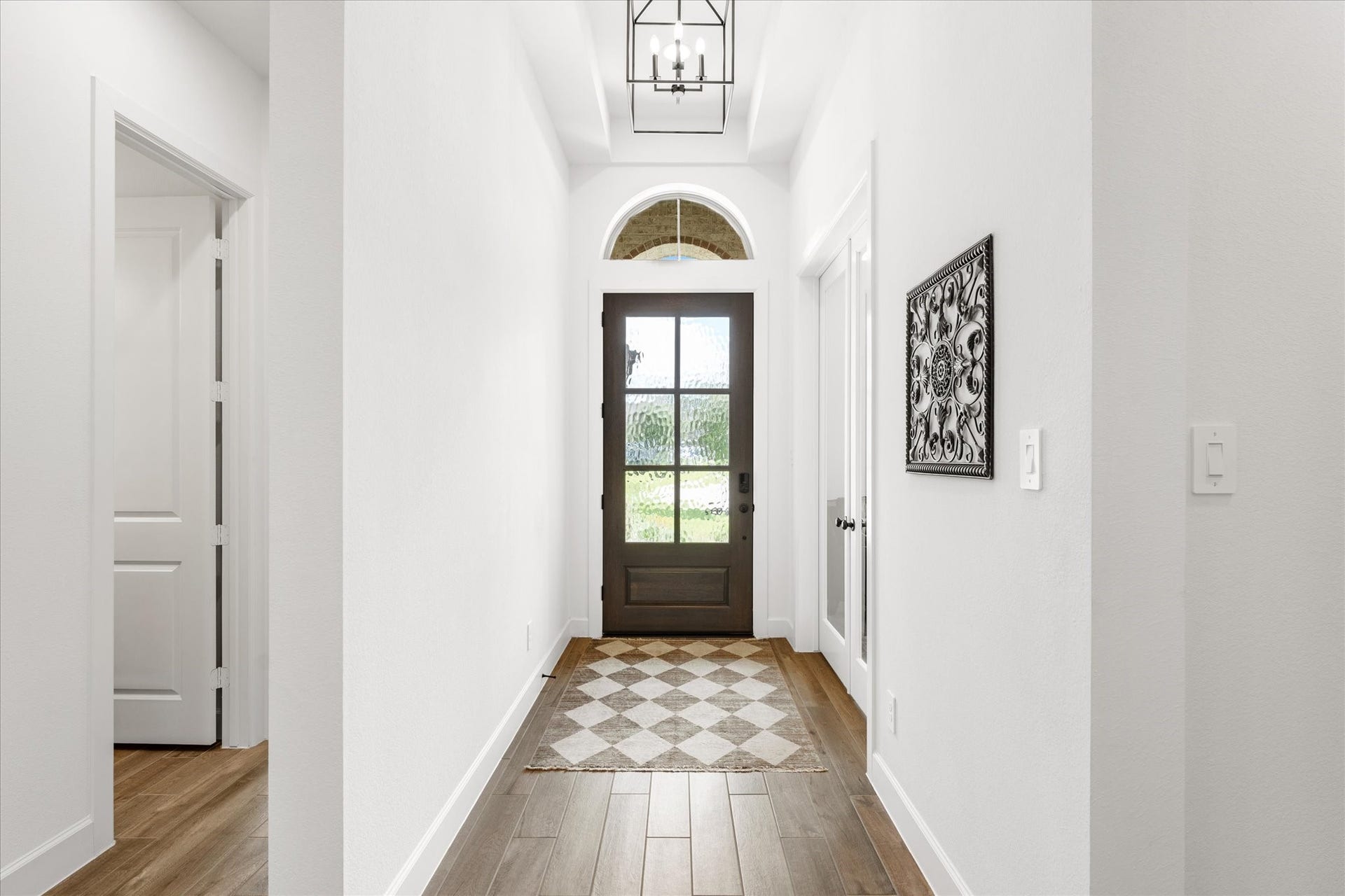 607 Starlit Sky Court, Willis, TX 77318 Hall entry with 2 bedrooms & full bath to left