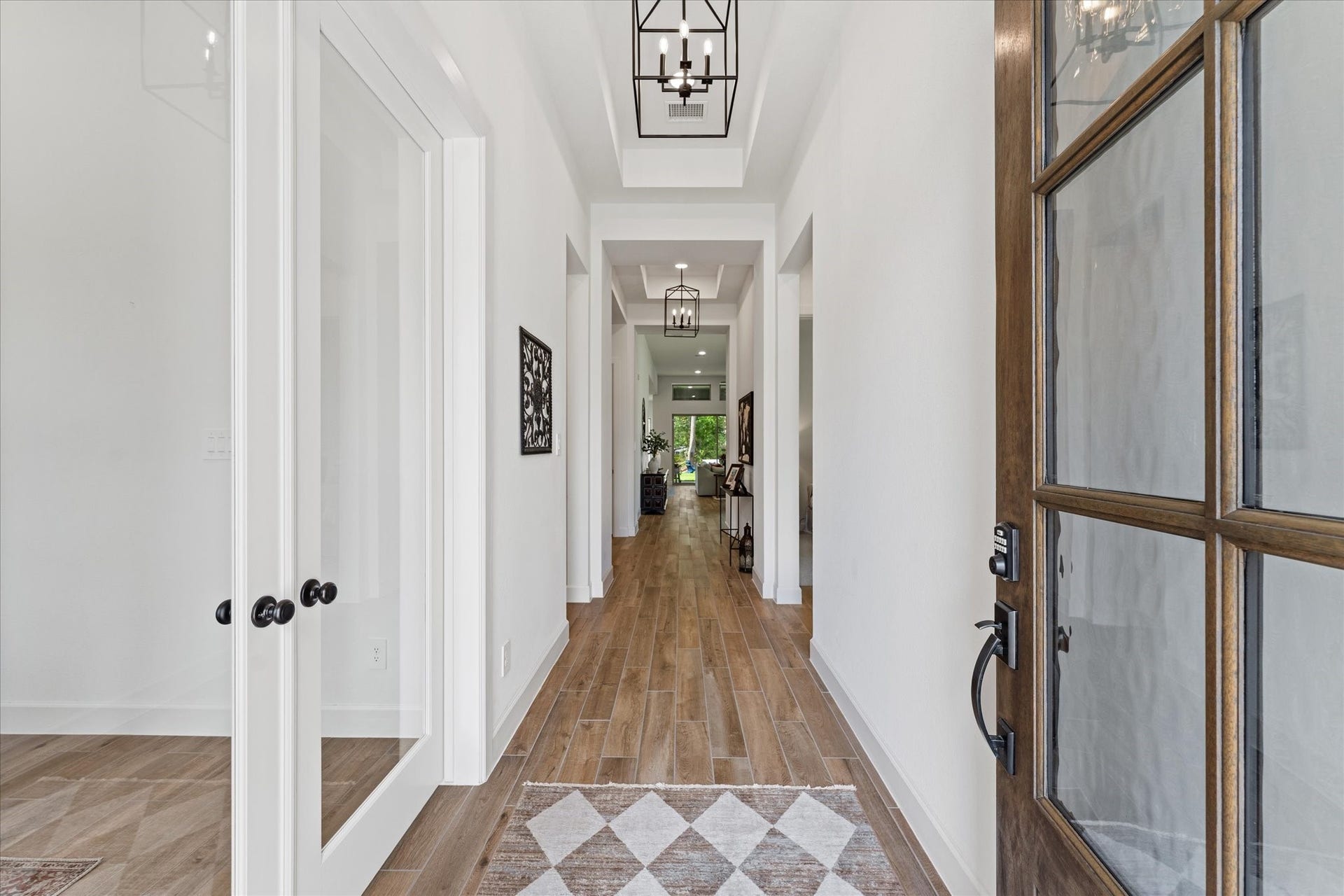 607 Starlit Sky Court, Willis, TX 77318 Gracious welcome with office on left