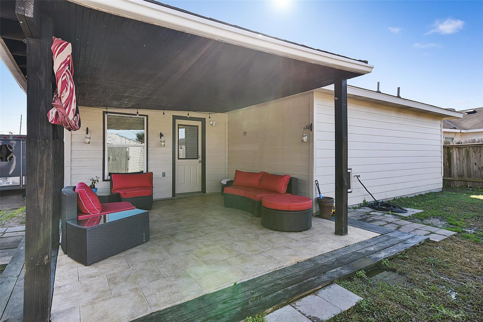 18114 Hanover Glen Lane, Richmond, TX 77407 View of the covered back patio with tile