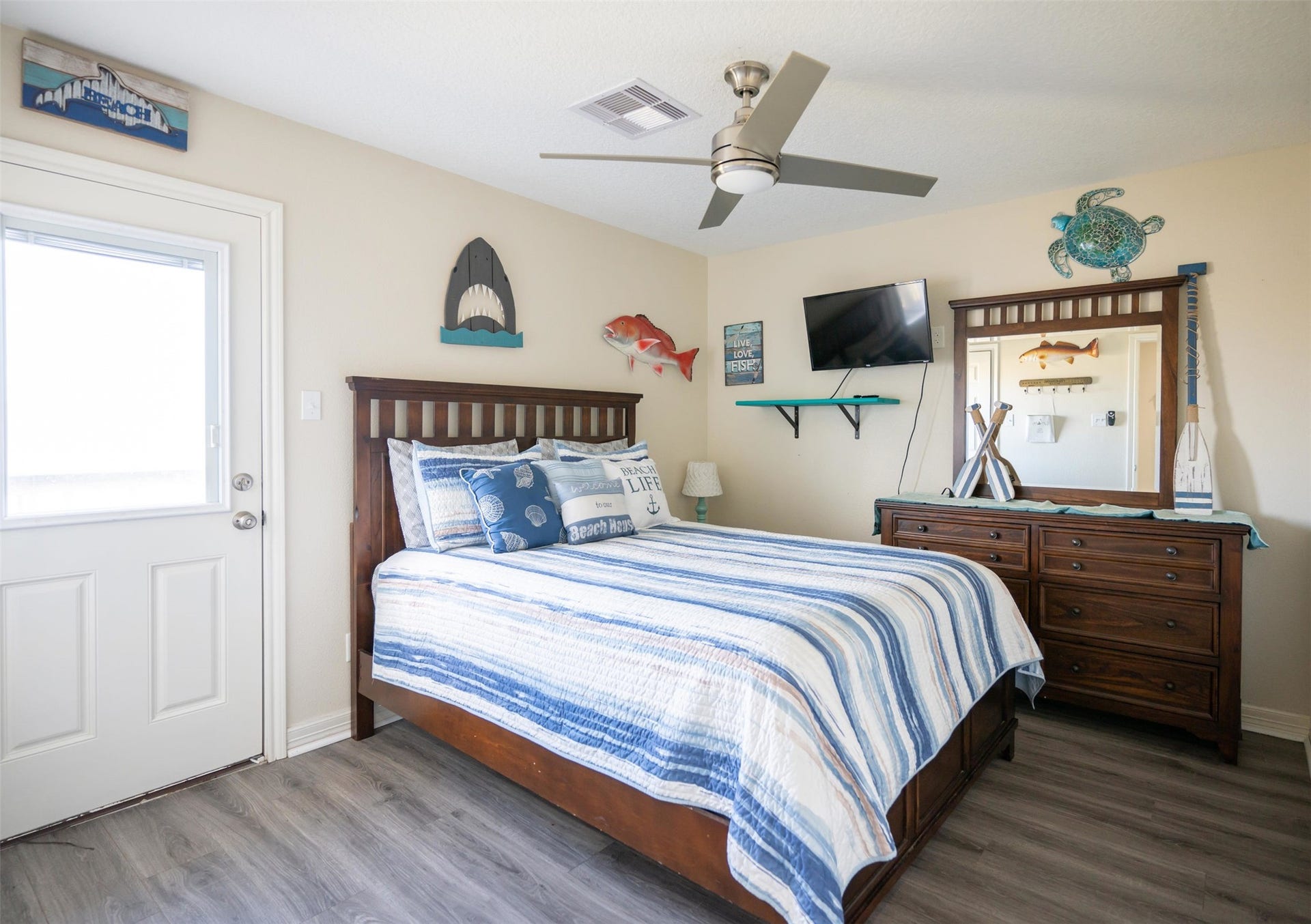 Spacious bedroom with a calm, coastal feel