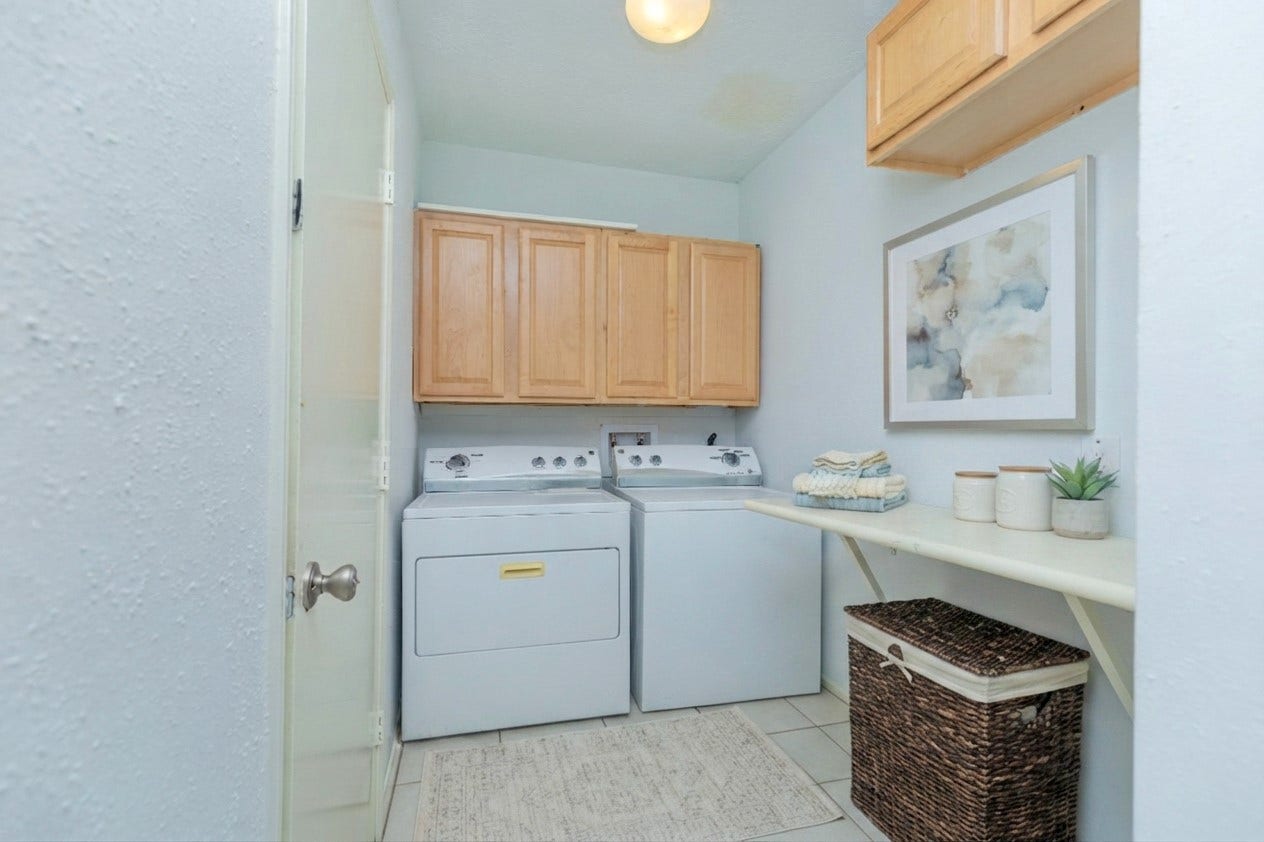 2711 Quail Valley East Drive, Missouri City, TX 77489 DEDICATED UTILITY ROOM W/ BUILT-IN STORAGE & CONVENIENT WORKSPACE.