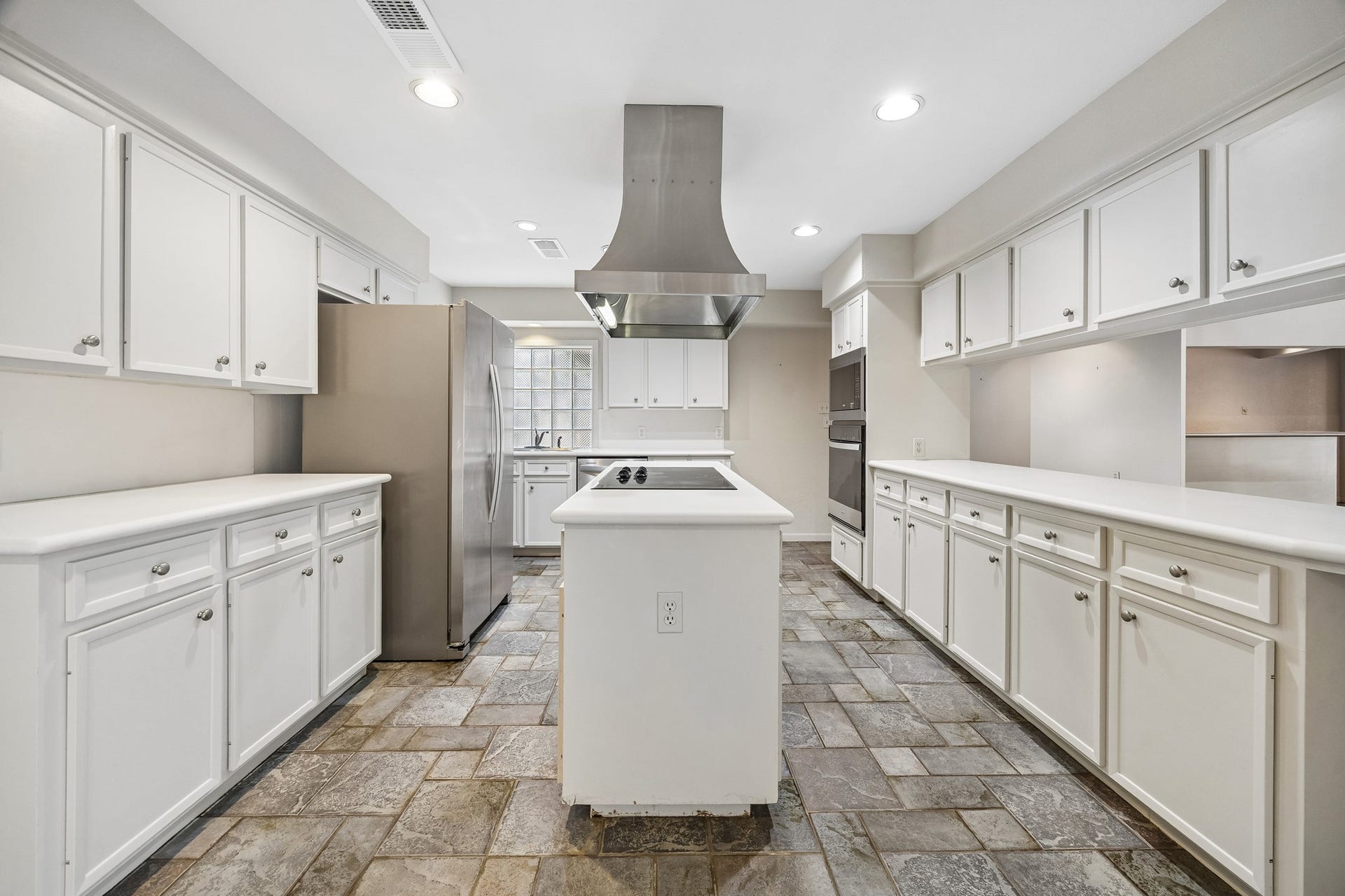 10327 Olympia Drive, Houston, TX 77042 another view showcasing the abundant storage and counter tops.