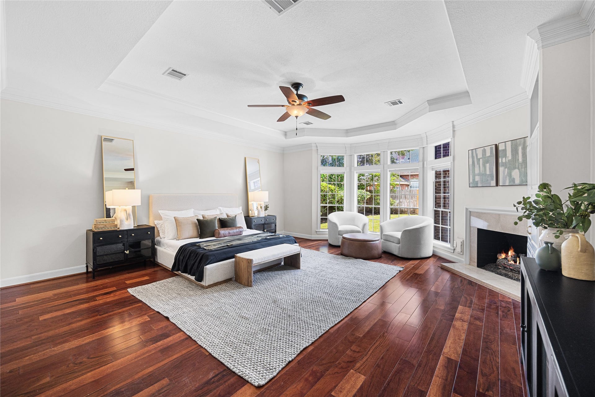 11822 Primwood Drive, Houston, TX 77070 Spacious primary suite featuring a cozy fireplace and sitting area.