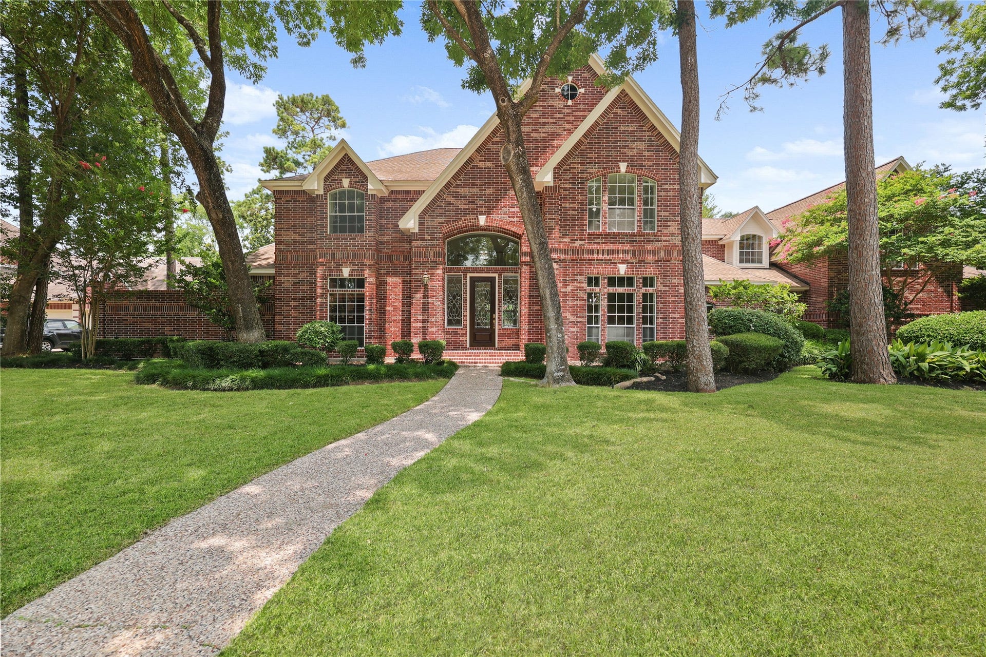 11822 Primwood Drive, Houston, TX 77070 Stately all-brick exterior with timeless architecture and exceptional curb appeal.