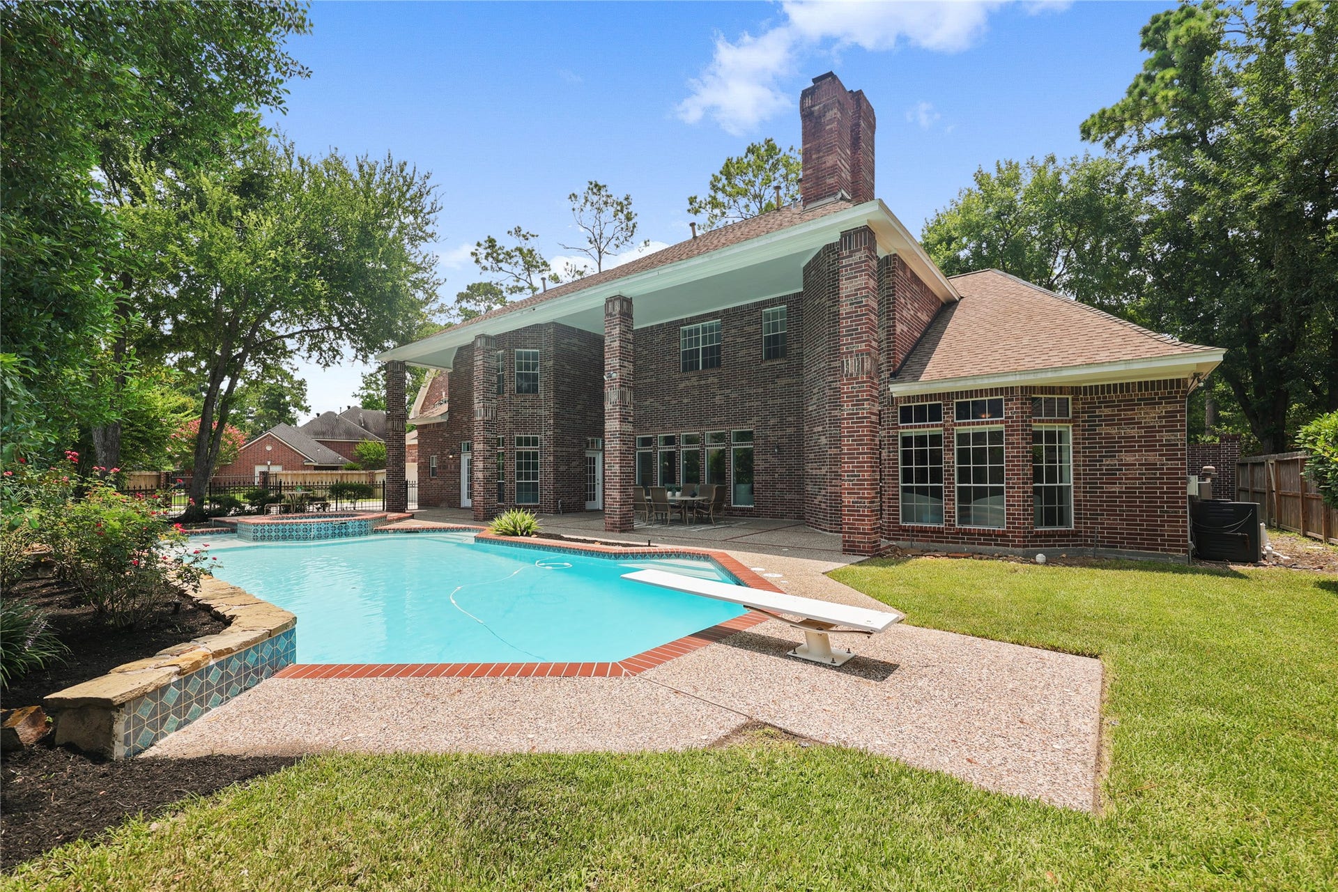 11822 Primwood Drive, Houston, TX 77070 Covered outdoor living space with panoramic pool views.