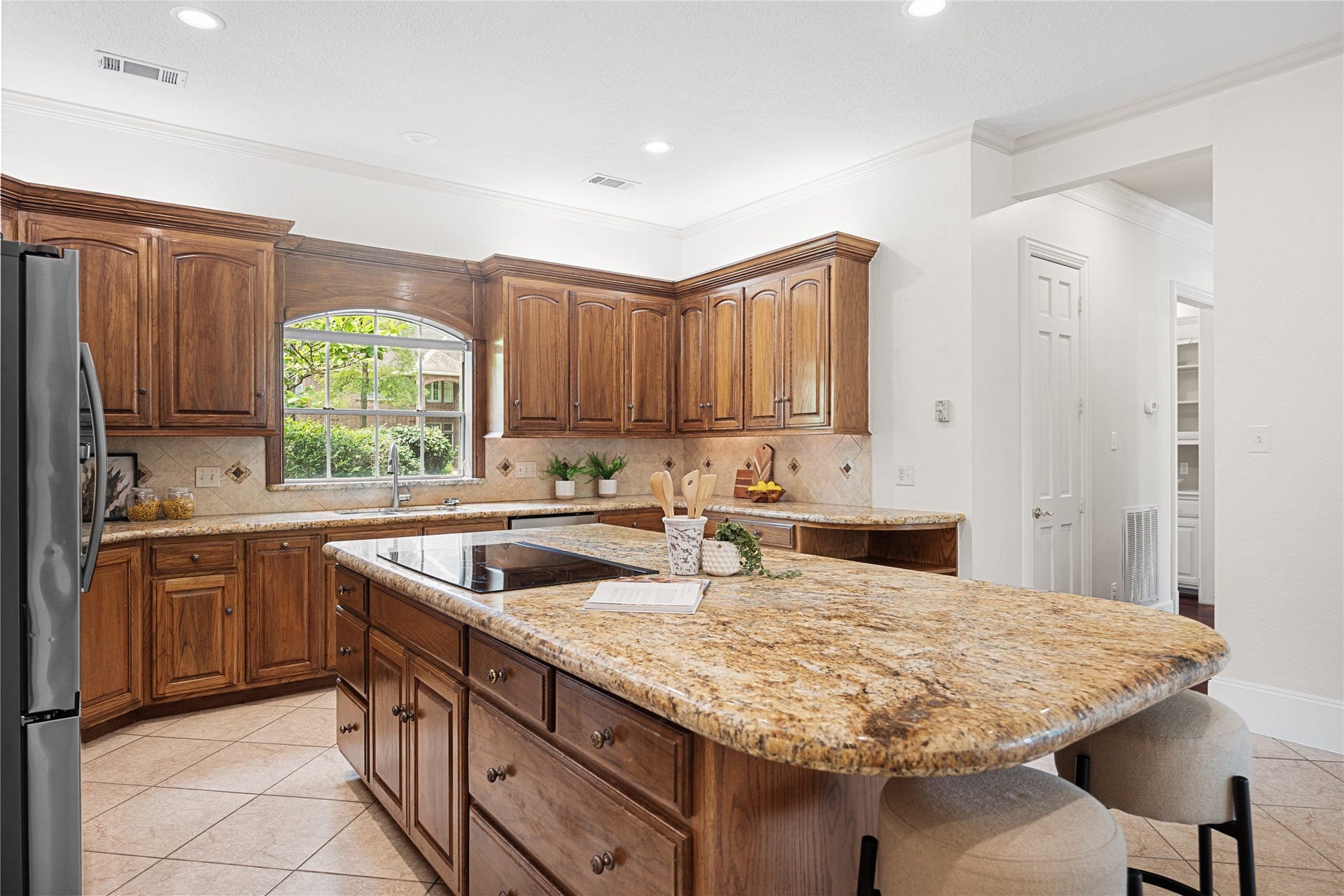 11822 Primwood Drive, Houston, TX 77070 Large center island serves as the heart of the home.