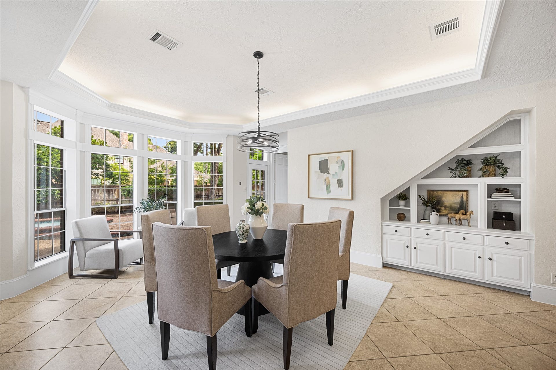 11822 Primwood Drive, Houston, TX 77070 Bright breakfast area with walls of windows overlooking the backyard.