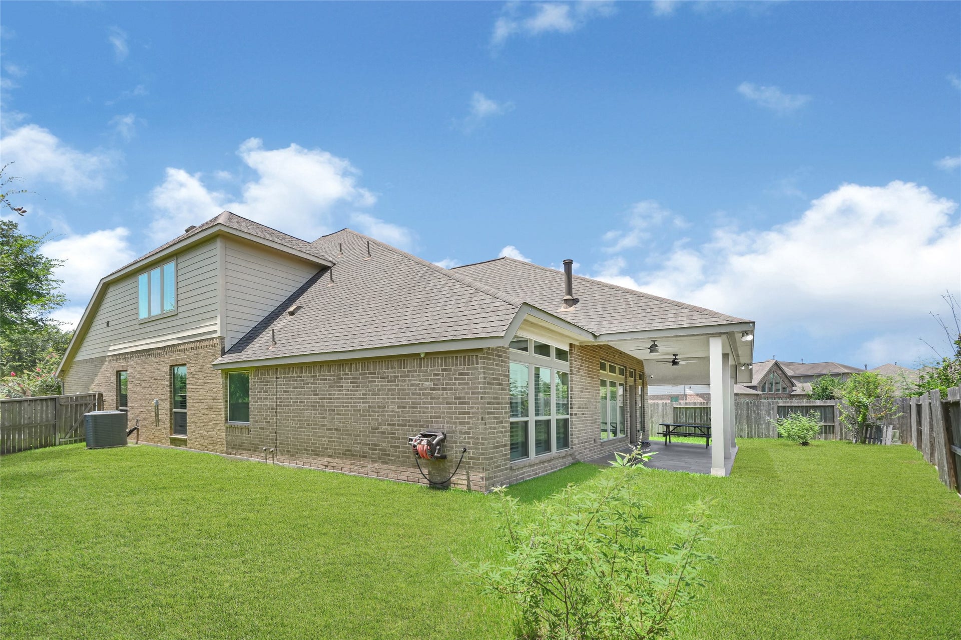 Experience outdoor living at its finest with a spacious backyard perfect for relaxation and entertainment.