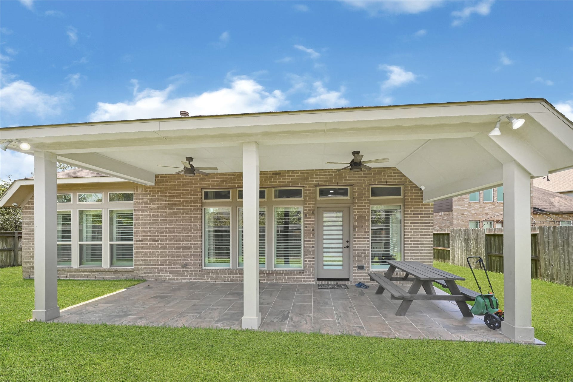Enjoy memorable outdoor gatherings on the spacious covered patio, perfect for relaxation and entertaining.