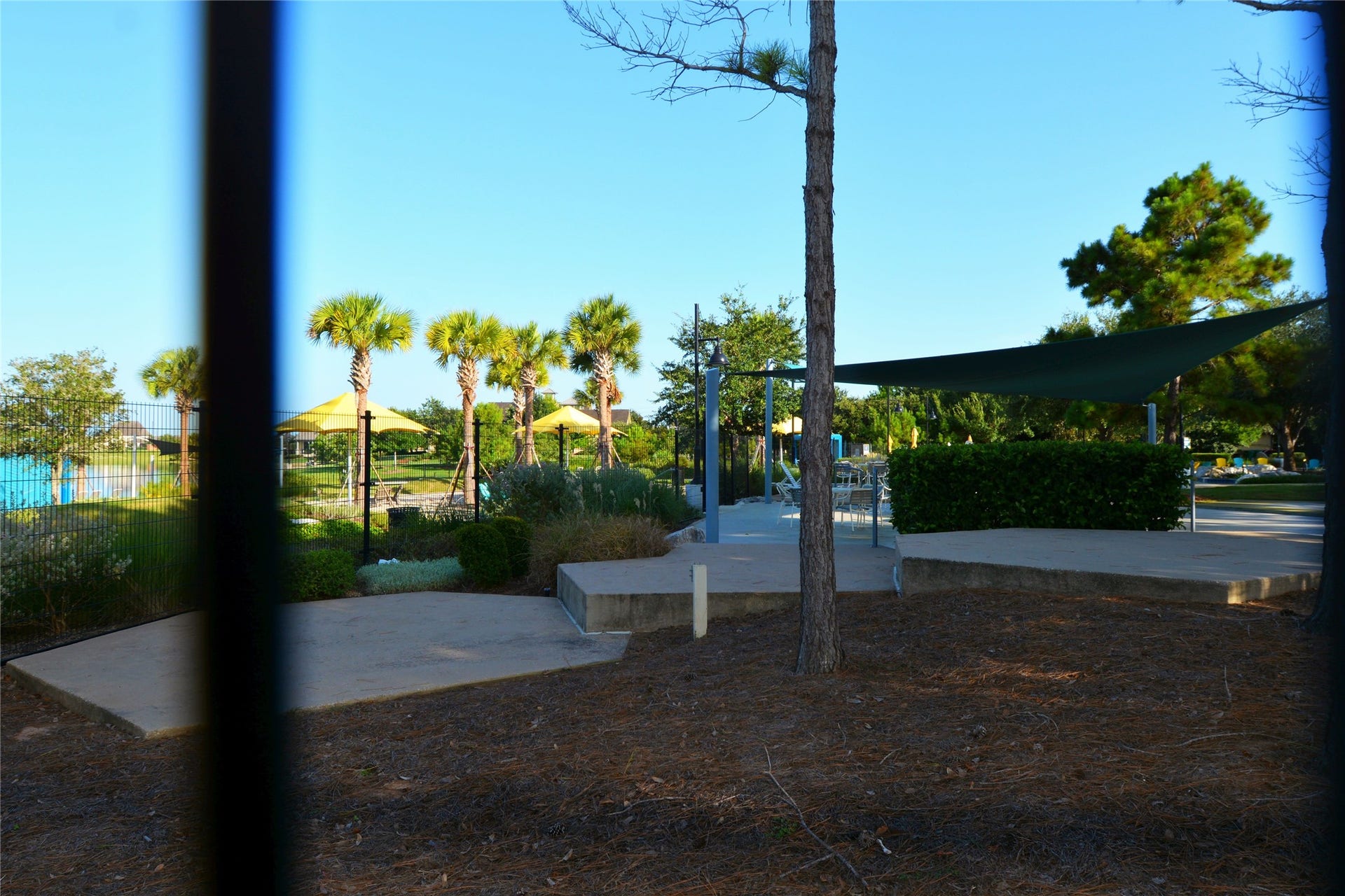 Enjoy serene living with a community pool and picturesque lake just steps from your door.
