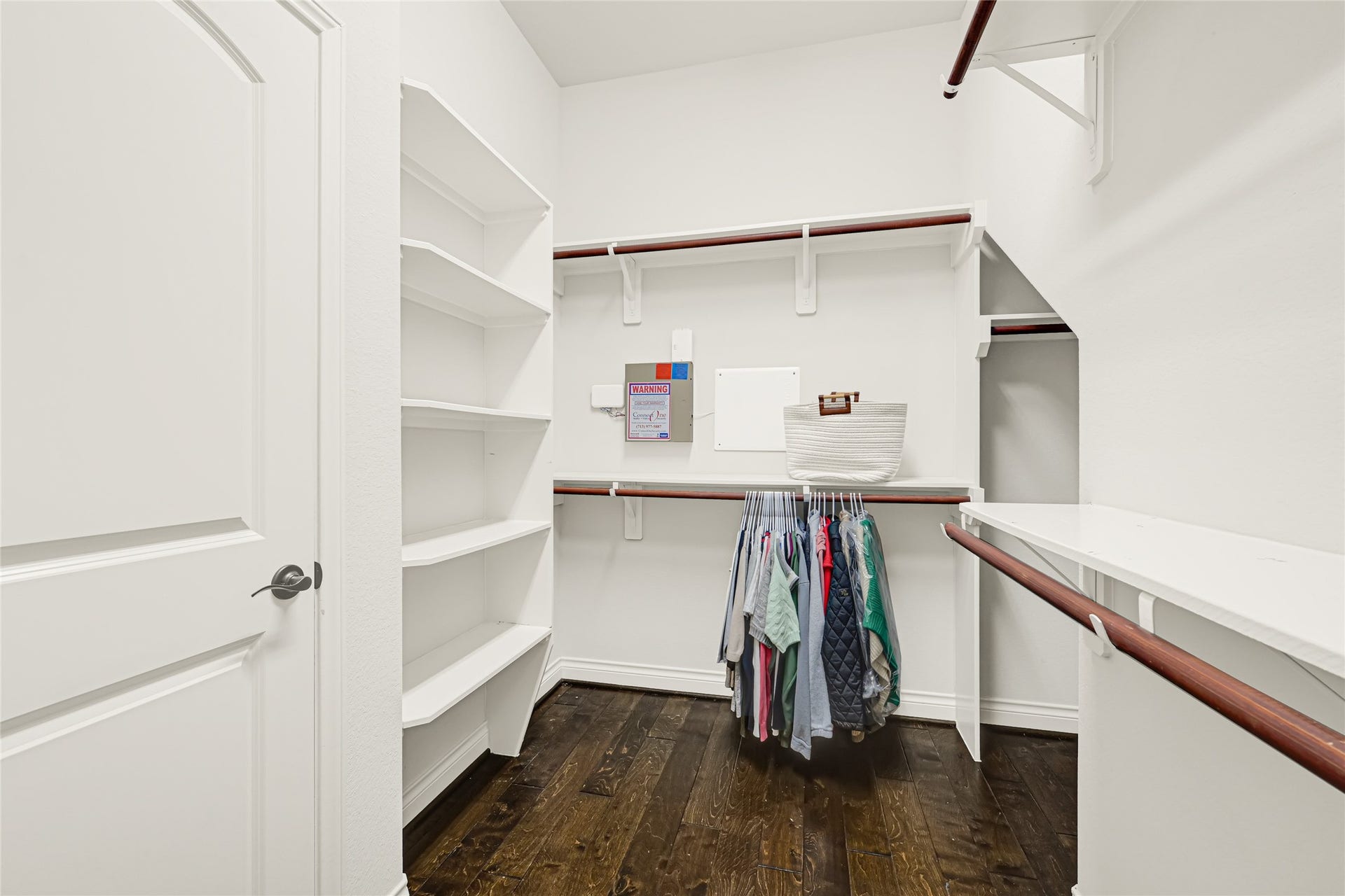 Experience serene comfort in this spacious bedroom, featuring beautiful wood floors and a convenient primary walk-in closet for all your storage needs.