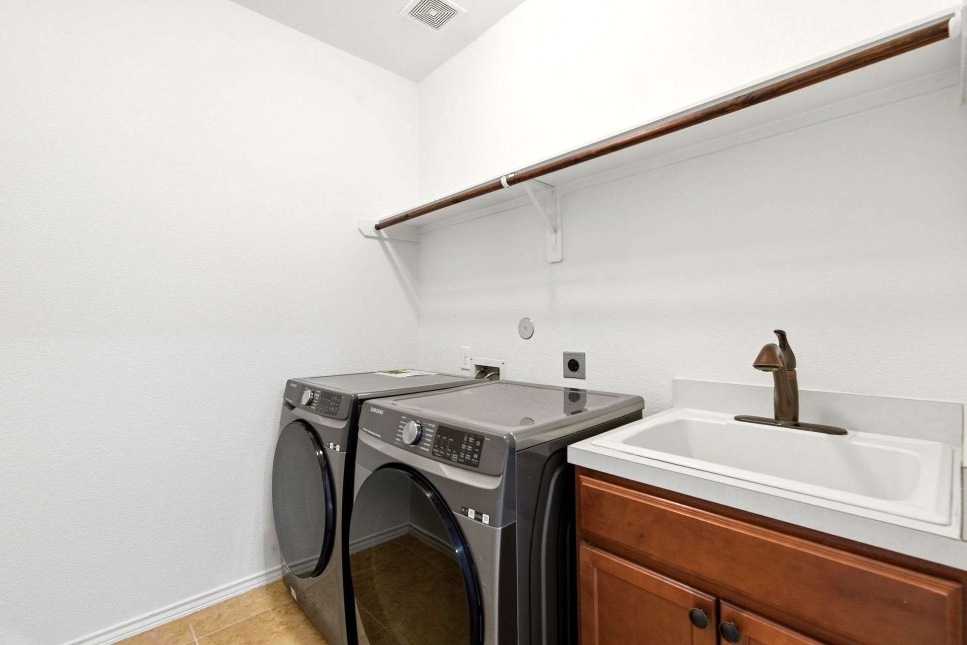 25322 Alverstone Drive, Katy, TX 77494 The laundry room features a convenient utility sink, and WASHER & DRYER ARE INCLUDED.