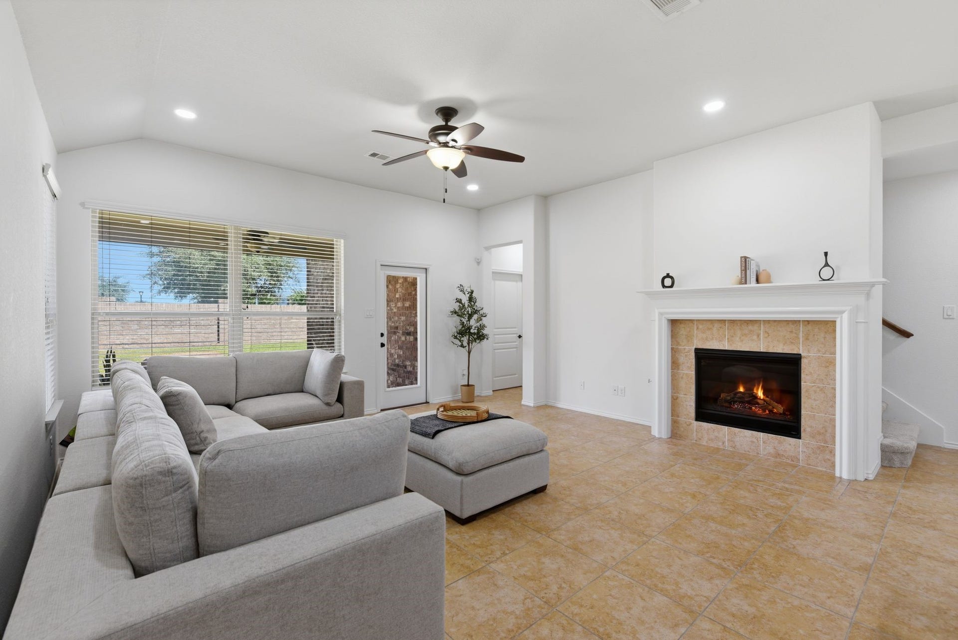 25322 Alverstone Drive, Katy, TX 77494 opens to the main living area with a cozy fireplace