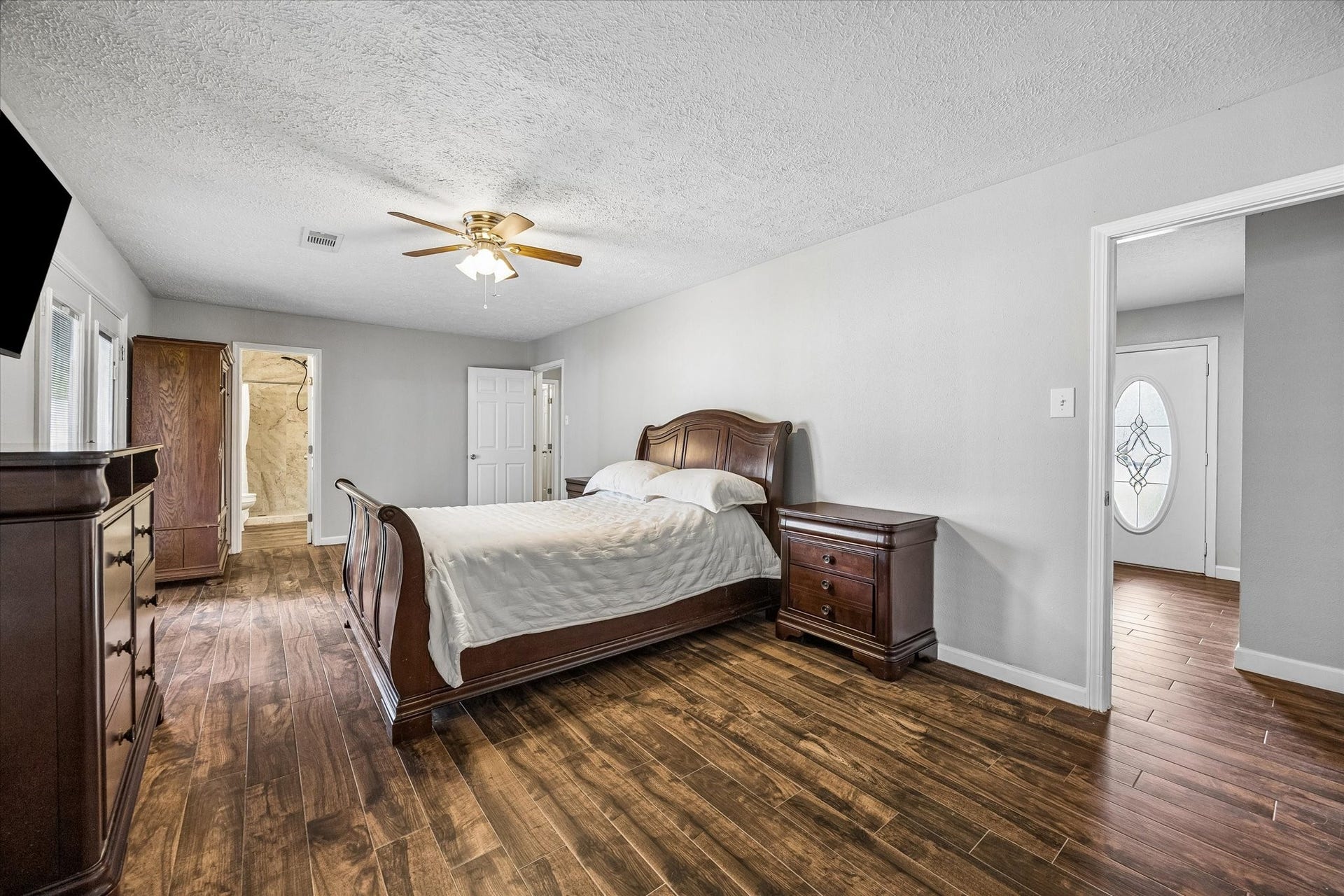 The primary bedroom features the added convenience of an ensuite bathroom, offering privacy and easy access for everyday comfort.