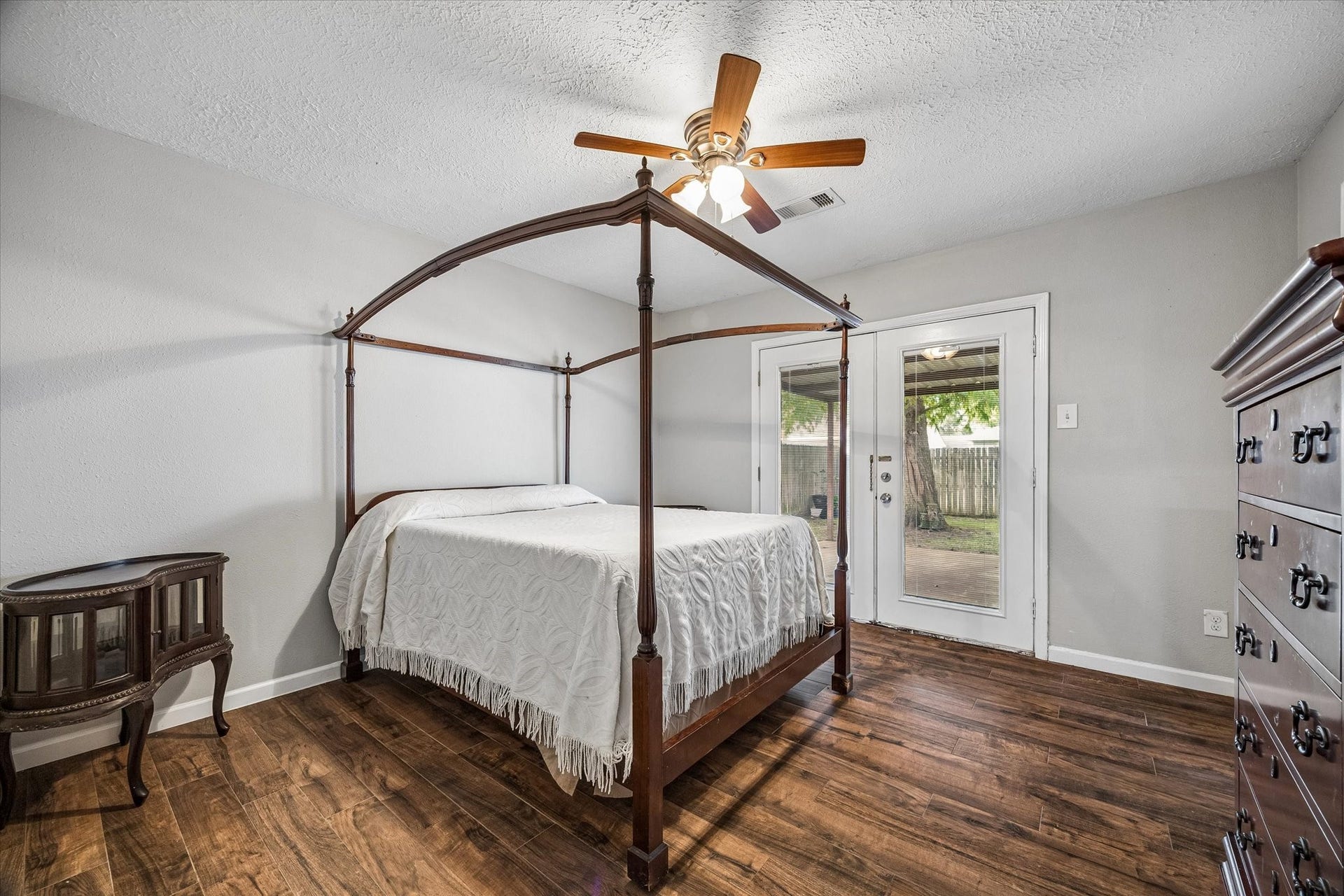 The secondary bedroom opens directly to the back patio, offering a versatile space ideal for a home office, guest room, or private retreat with easy access to the outdoors.
The secondary bedroom offers a comfortable retreat with direct access to the back patio, creating a seamless connection to outdoor living.