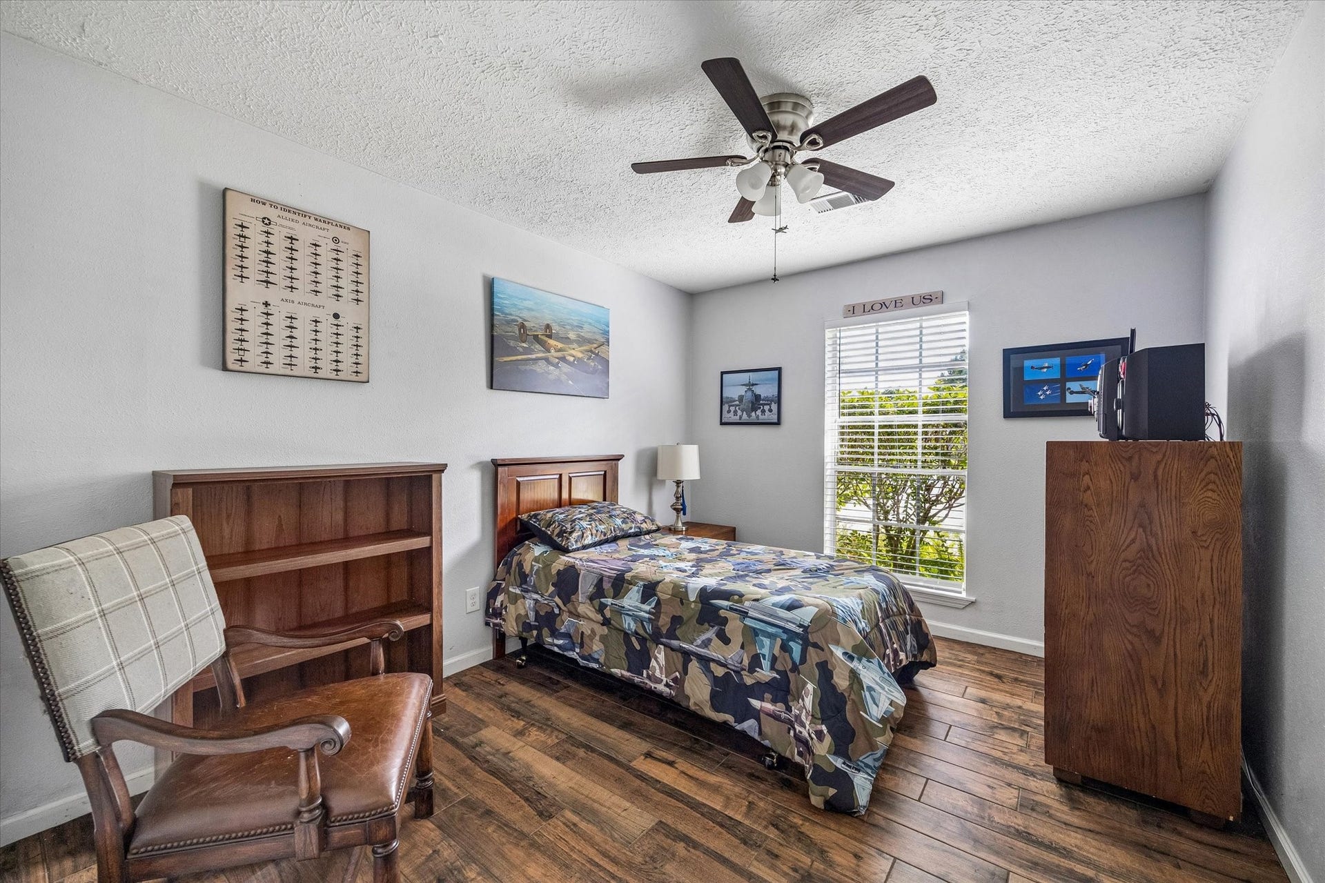 The secondary bedroom features plenty of natural light and convenient access to the bathroom, creating a comfortable and functional space for everyday living.