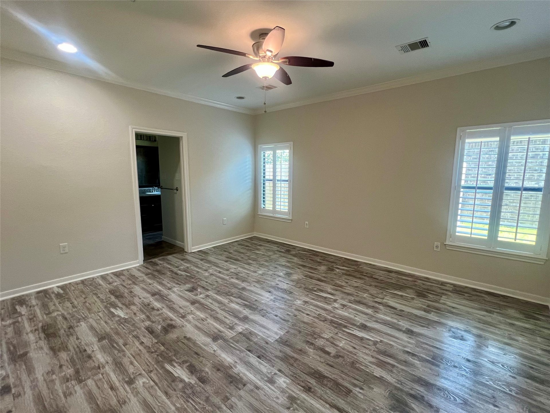Primary bedroom with plenty of natural light.