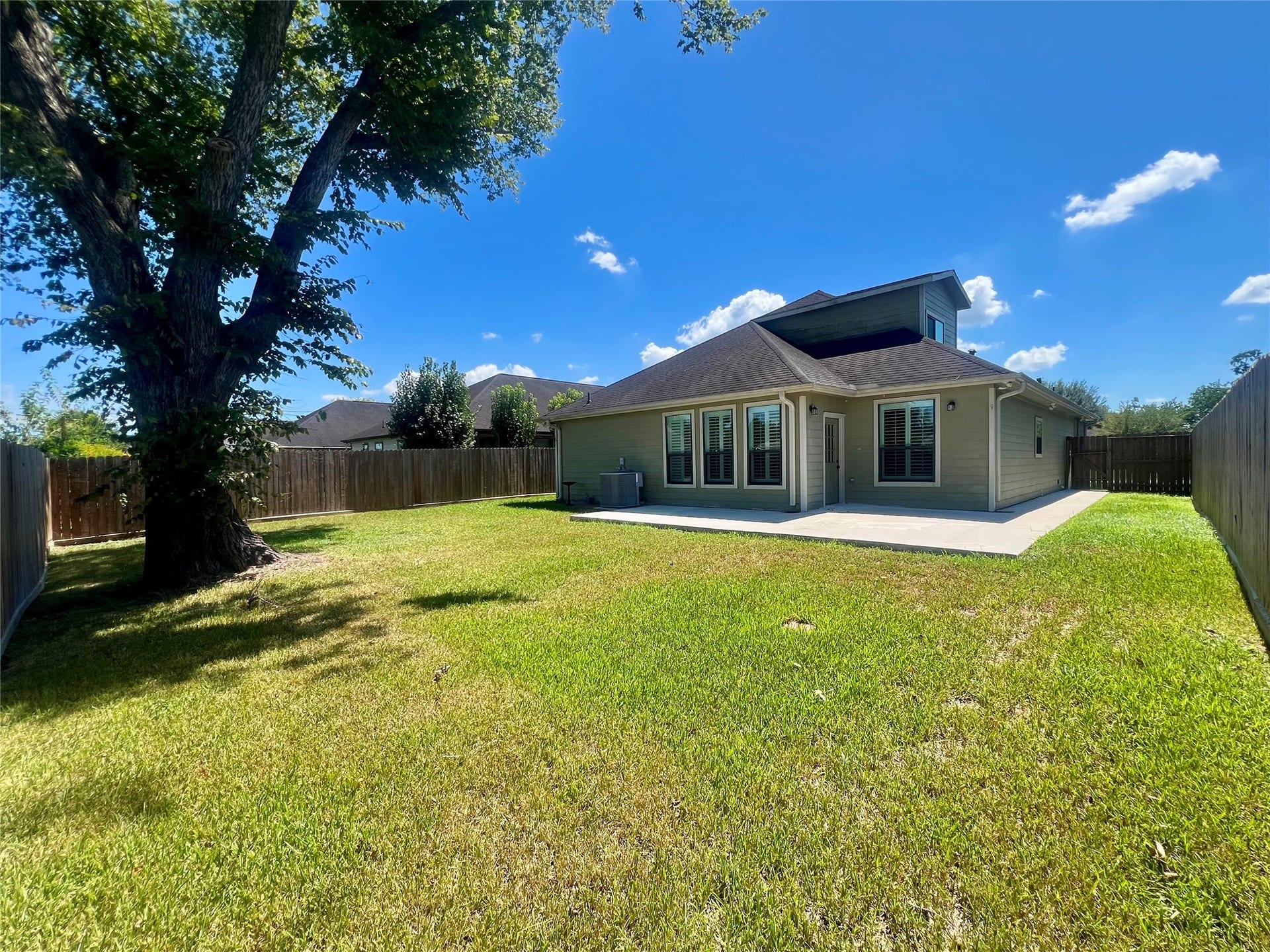 Pool sized back yard with shade tree and no back neighbors.
