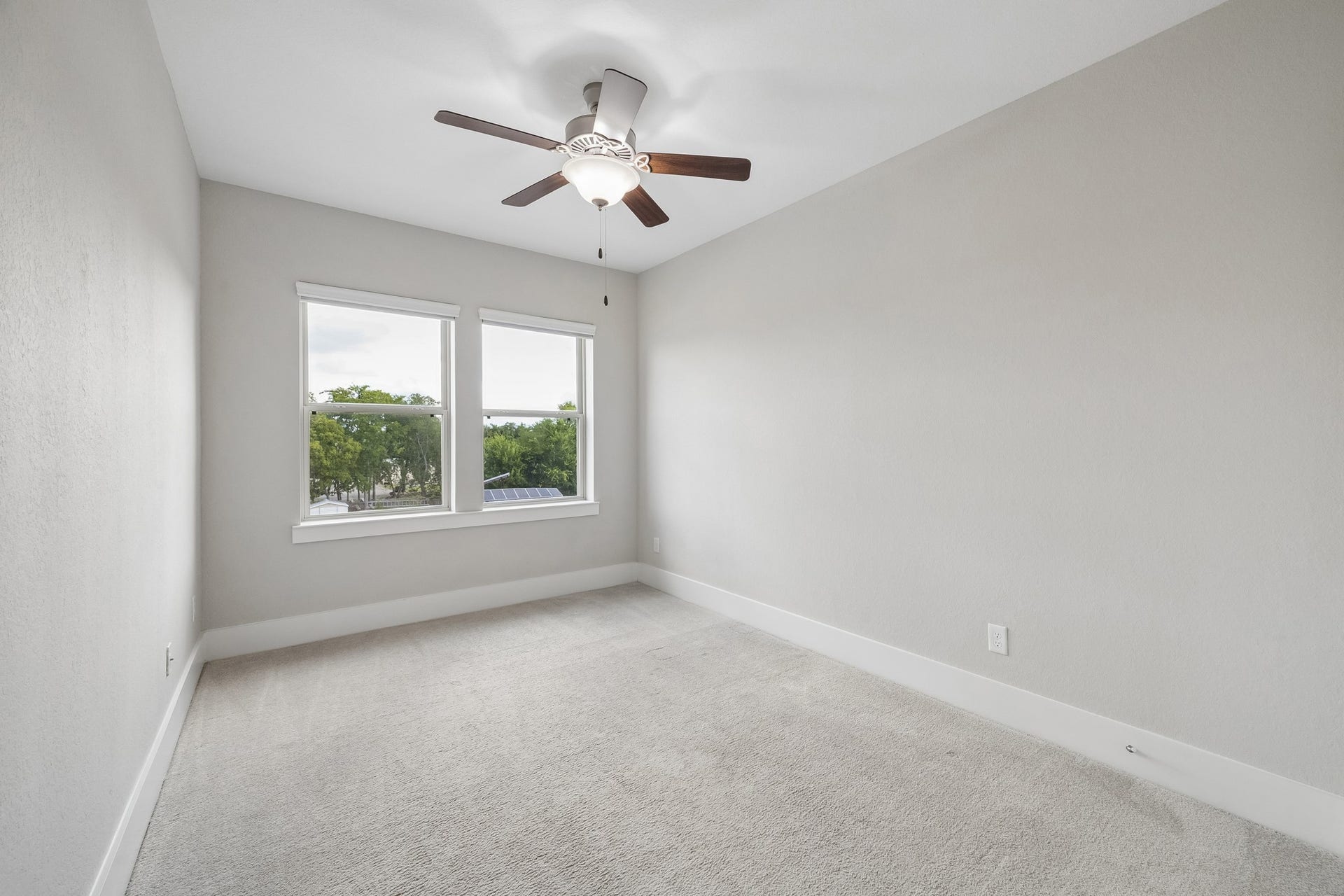 The fourth bedroom is tucked away on the third floor, creating a peaceful retreat for guests or household members.
