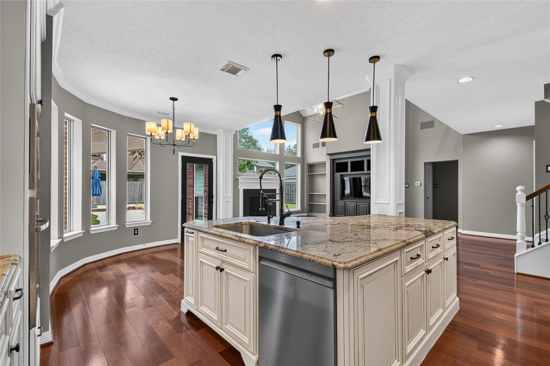 11810 Rue Beaujon Court, Tomball, TX 77377 Oversized island anchors the kitchen with generous workspace, storage and seating for casual meals.