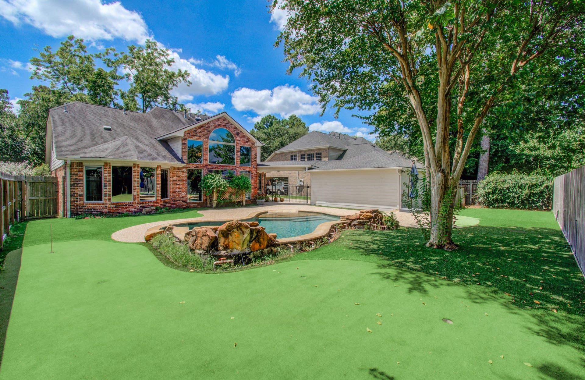 11810 Rue Beaujon Court, Tomball, TX 77377 Low-maintenance turf surrounds the pool and provides additional backyard space for play, pets and outdoor entertaining.