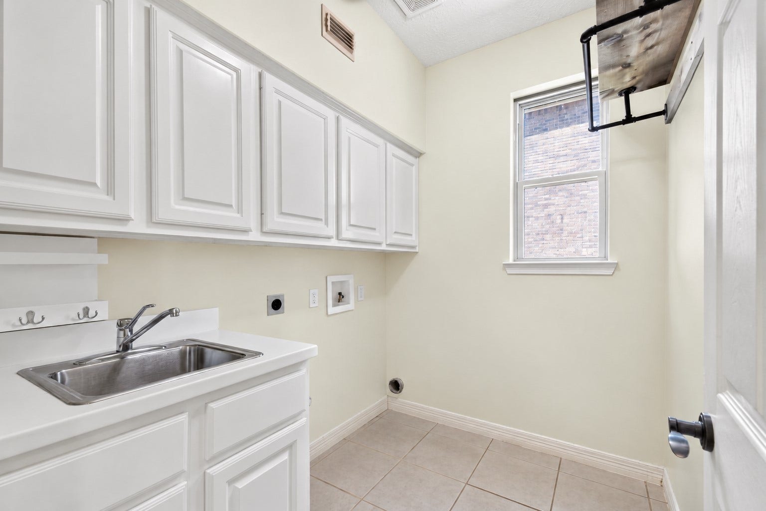 11810 Rue Beaujon Court, Tomball, TX 77377 Spacious laundry room with added storage.