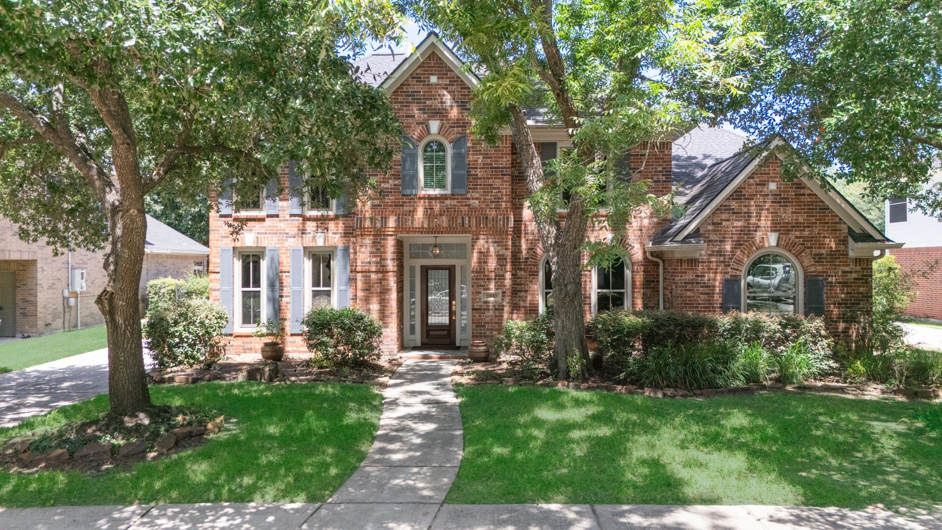 11810 Rue Beaujon Court, Tomball, TX 77377 Classic brick architecture, mature landscaping and an inviting front entry give this home timeless curb appeal.
