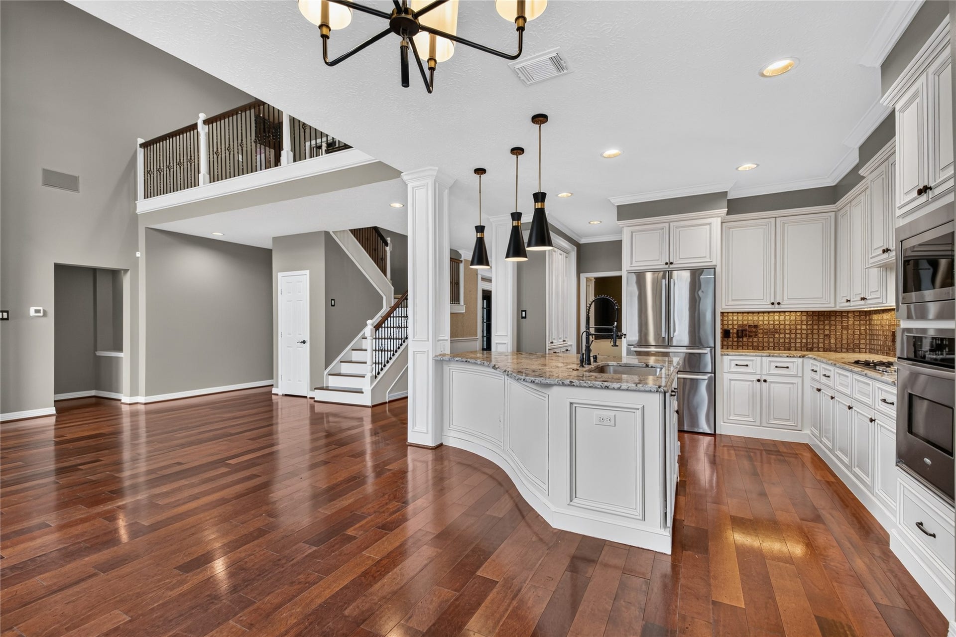 11810 Rue Beaujon Court, Tomball, TX 77377 Open-concept kitchen, breakfast area and family room create an easy flow for everyday living and entertaining.