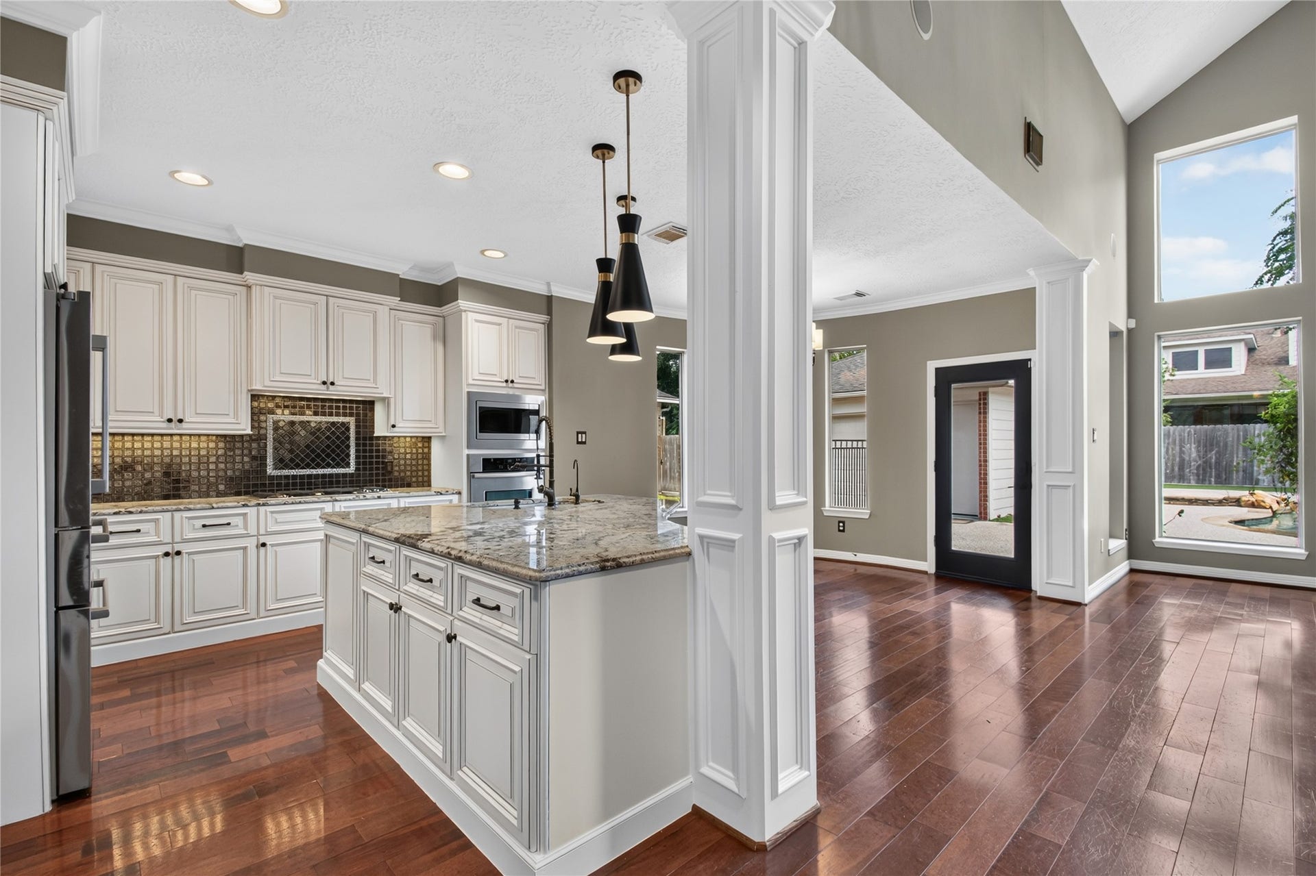 11810 Rue Beaujon Court, Tomball, TX 77377 Spacious island kitchen opens directly to the family room with abundant prep, storage and gathering space.