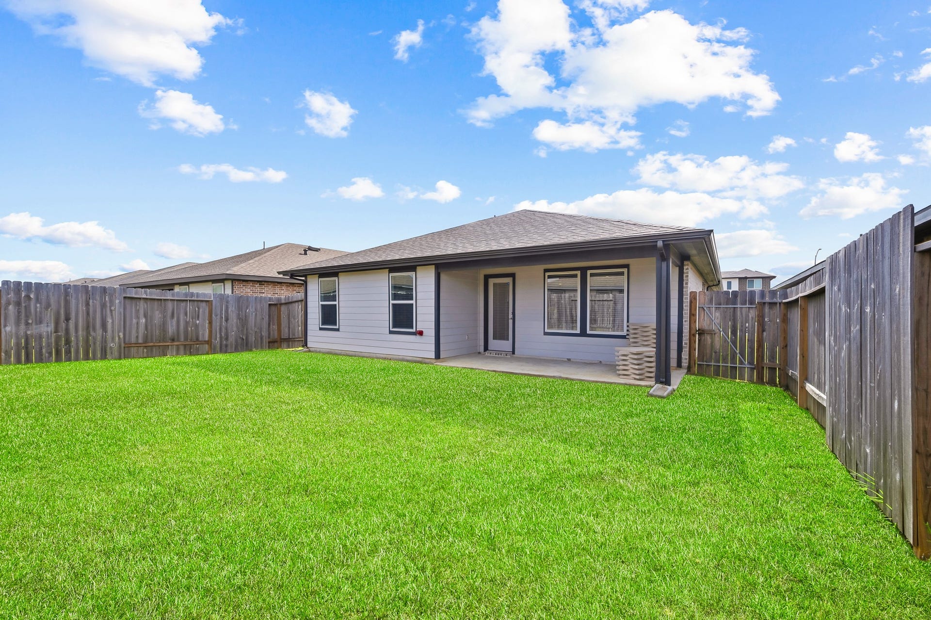 7002 Fleetwood Crescent Way, Richmond, TX 77407 Charming single-story home with a spacious, well-maintained backyard. Features a covered patio, perfect for outdoor relaxation. The yard is fully fenced for privacy, making it ideal for families and pets.