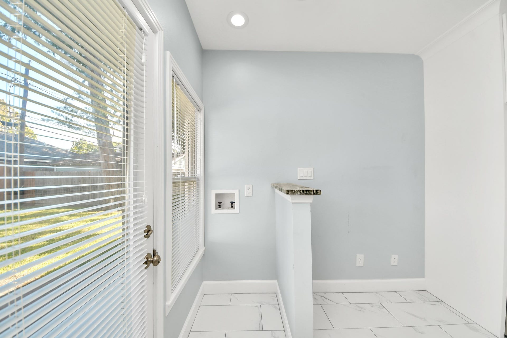 909 Fugate Street, Houston, TX 77009 A bright and functional utility area offering ample natural light and modern finishes, perfect for your laundry needs.