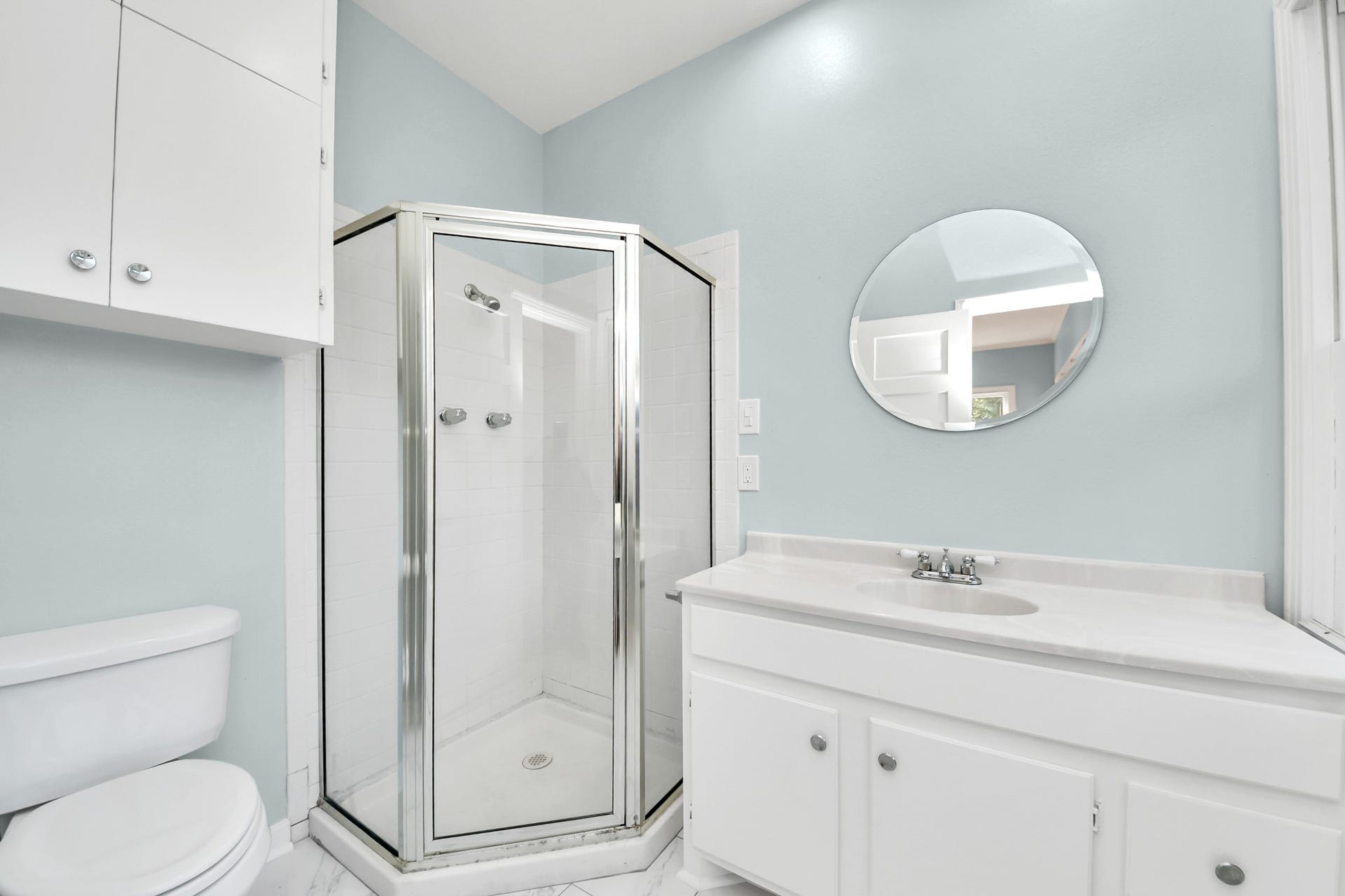 909 Fugate Street, Houston, TX 77009 Experience modern elegance in the primary bath featuring a sleek walk-in shower and stylish fixtures.