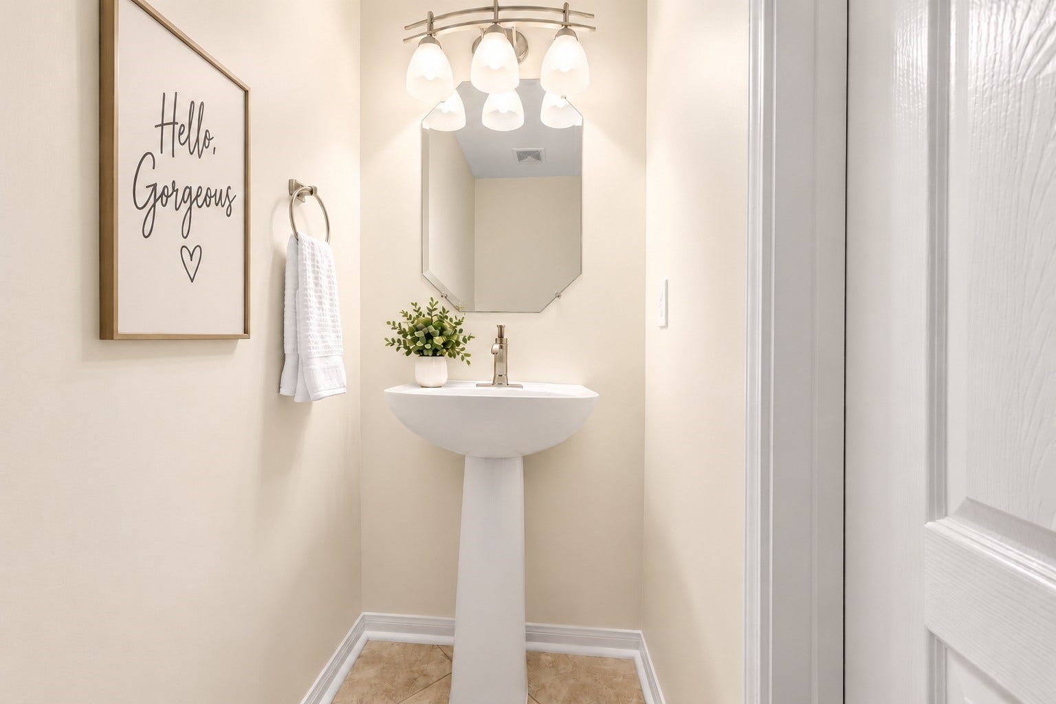 24815 Giltspur Way, Spring, TX 77389 ust steps from the family room, this charming GUEST HALF BATH is perfectly positioned for family & visitors alike! Features include a stylish pedestal sink, brushed-nickel fixtures, contemporary three-light vanity lighting with frosted glass shades, decorative mirror & easy-care tile flooring. NO NEED FOR GUESTS TO VENTURE INTO YOUR PRIVATE LIVING QUARTERS!