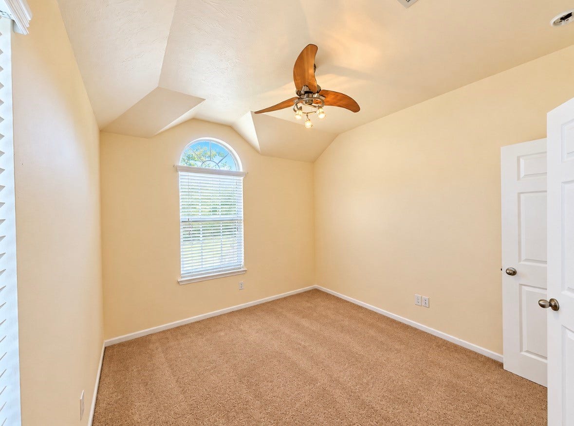 3722 Elderberry Drive, Dickinson, TX 77539 Lovely bedroom with vaulted ceiling, beautiful arched window & distinctive architectural character.